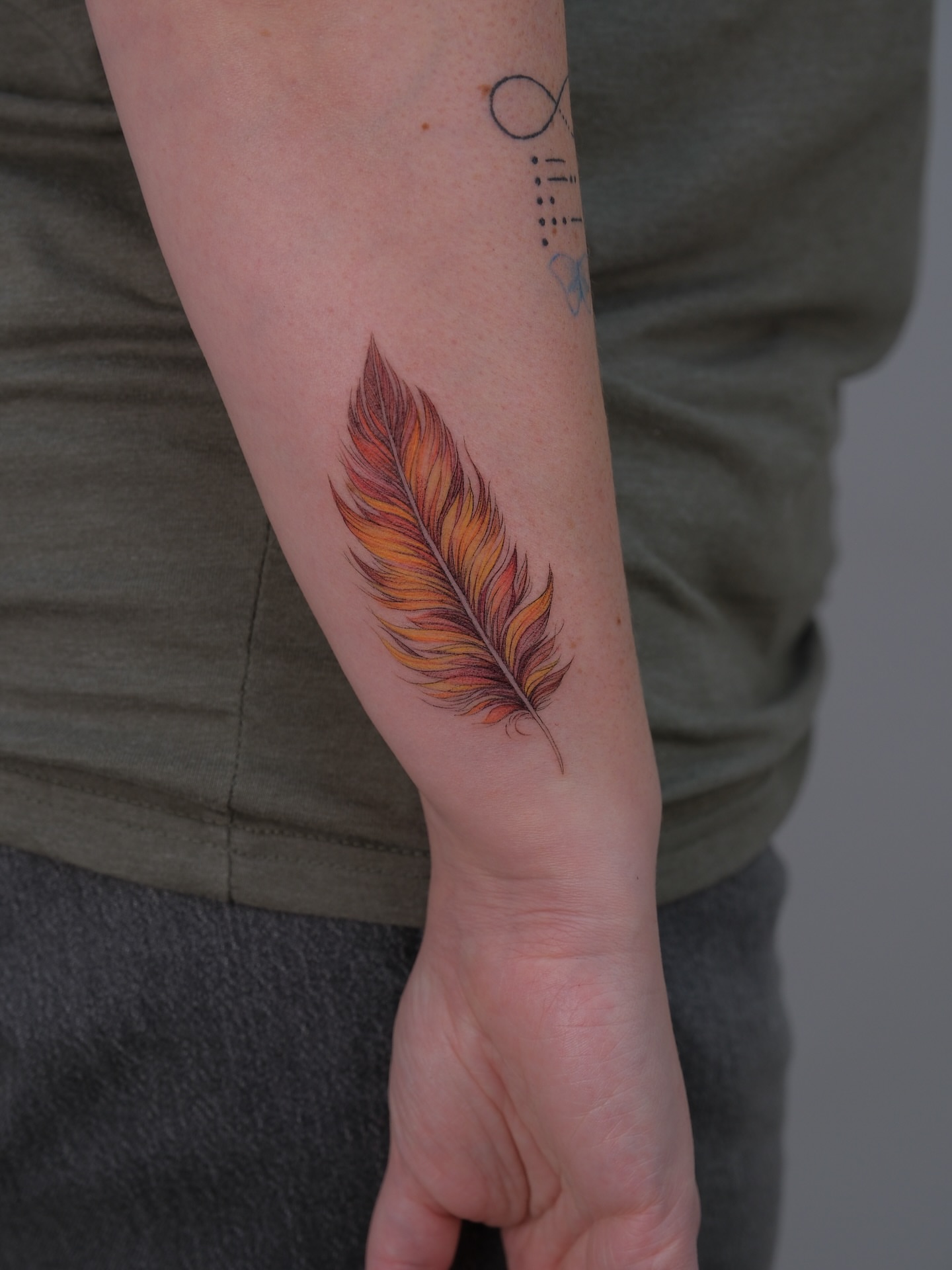 Feather realism tattoo on the forearm by Tattoo in Charlotte NC, Charlotte, North Carolina