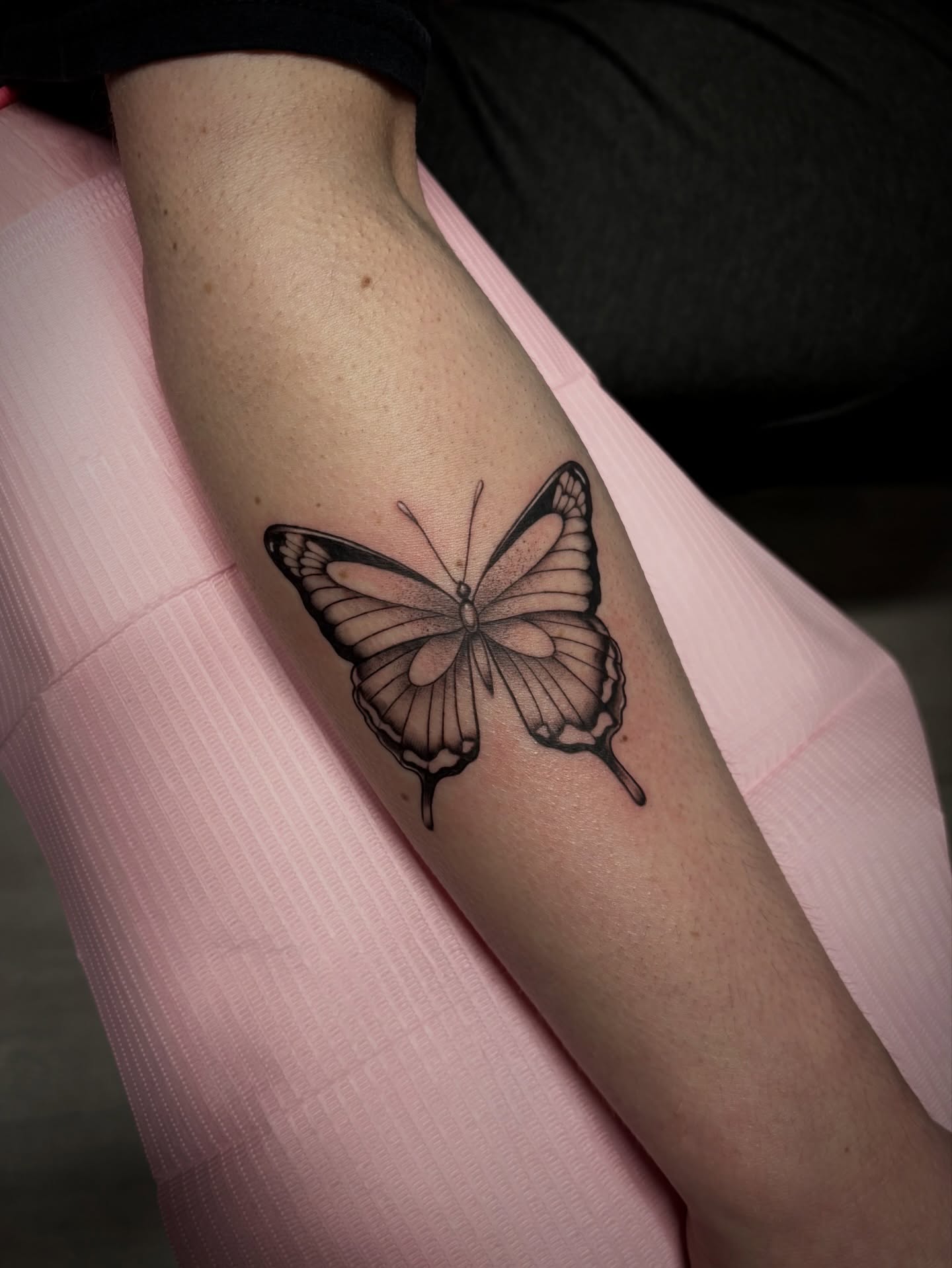 Butterfly black and grey tattoo on the forearm by Elixabeth