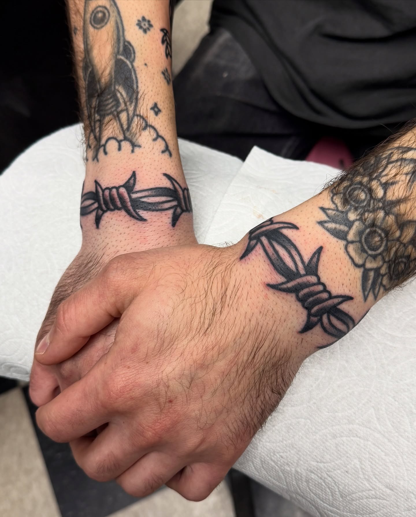 Barbed wire black and grey tattoo on the forearm by Joey Burdette Tattoos