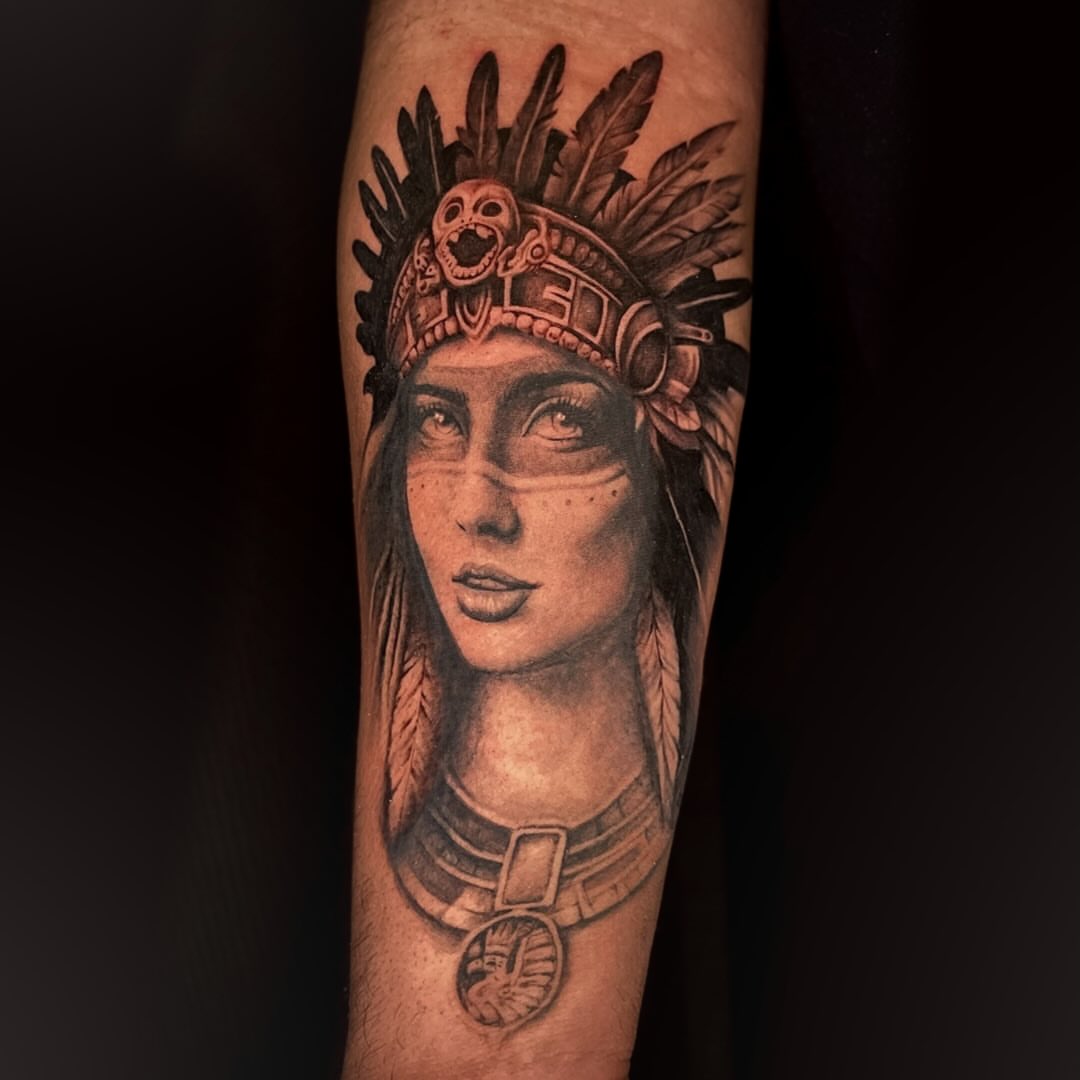 Indian headdress woman realism tattoo on the forearm by Bryce Presley, Mission, Kansas