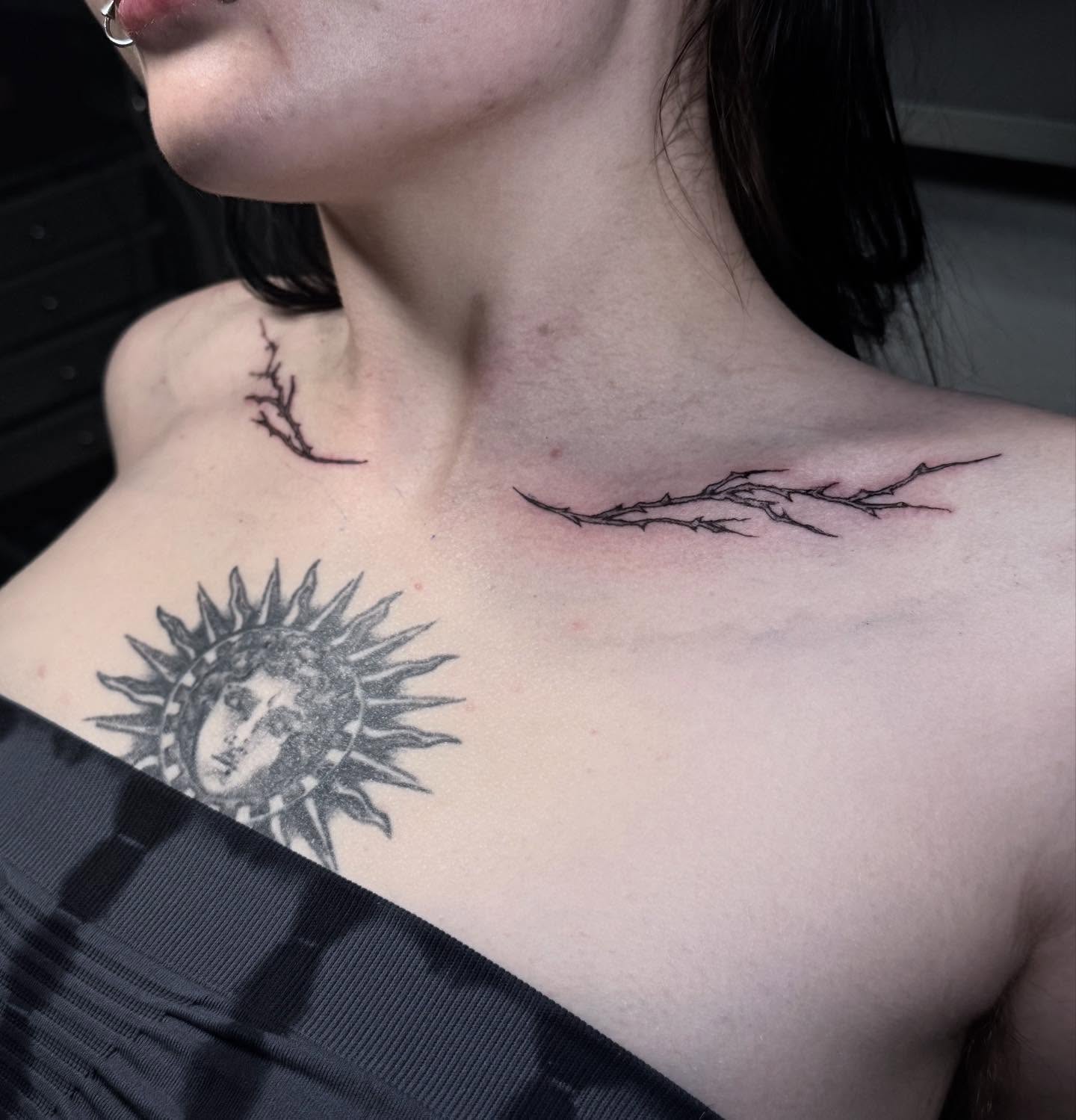 Sun and face black and grey tattoo on the chest by Cullen-Lee