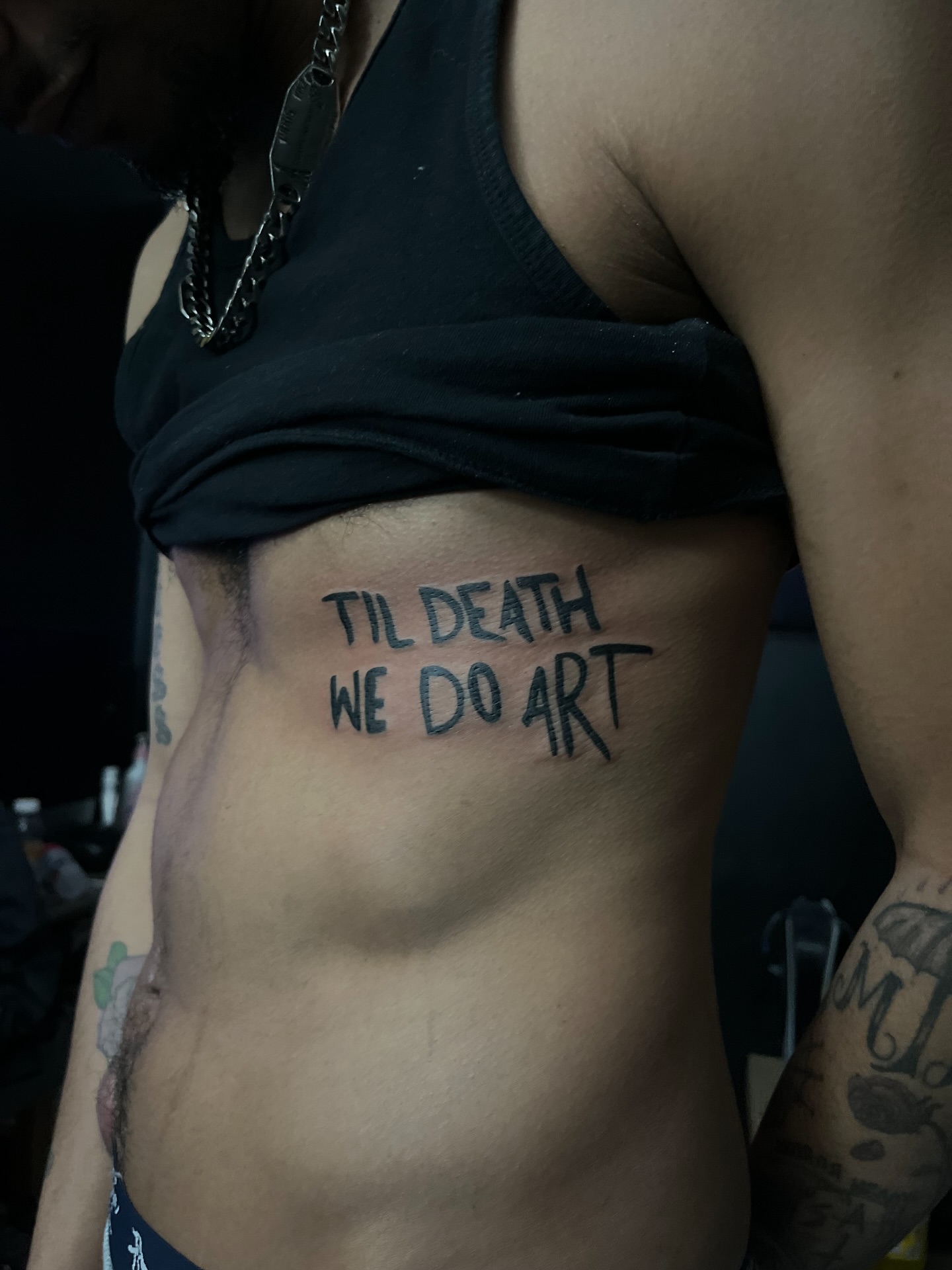 Til death we do art lettering script tattoo on the torso by Star Tattoos ⚜️