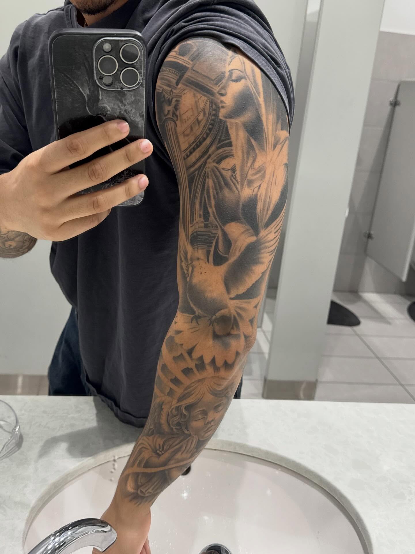 Religious figure realism tattoo on the forearm by Devin
