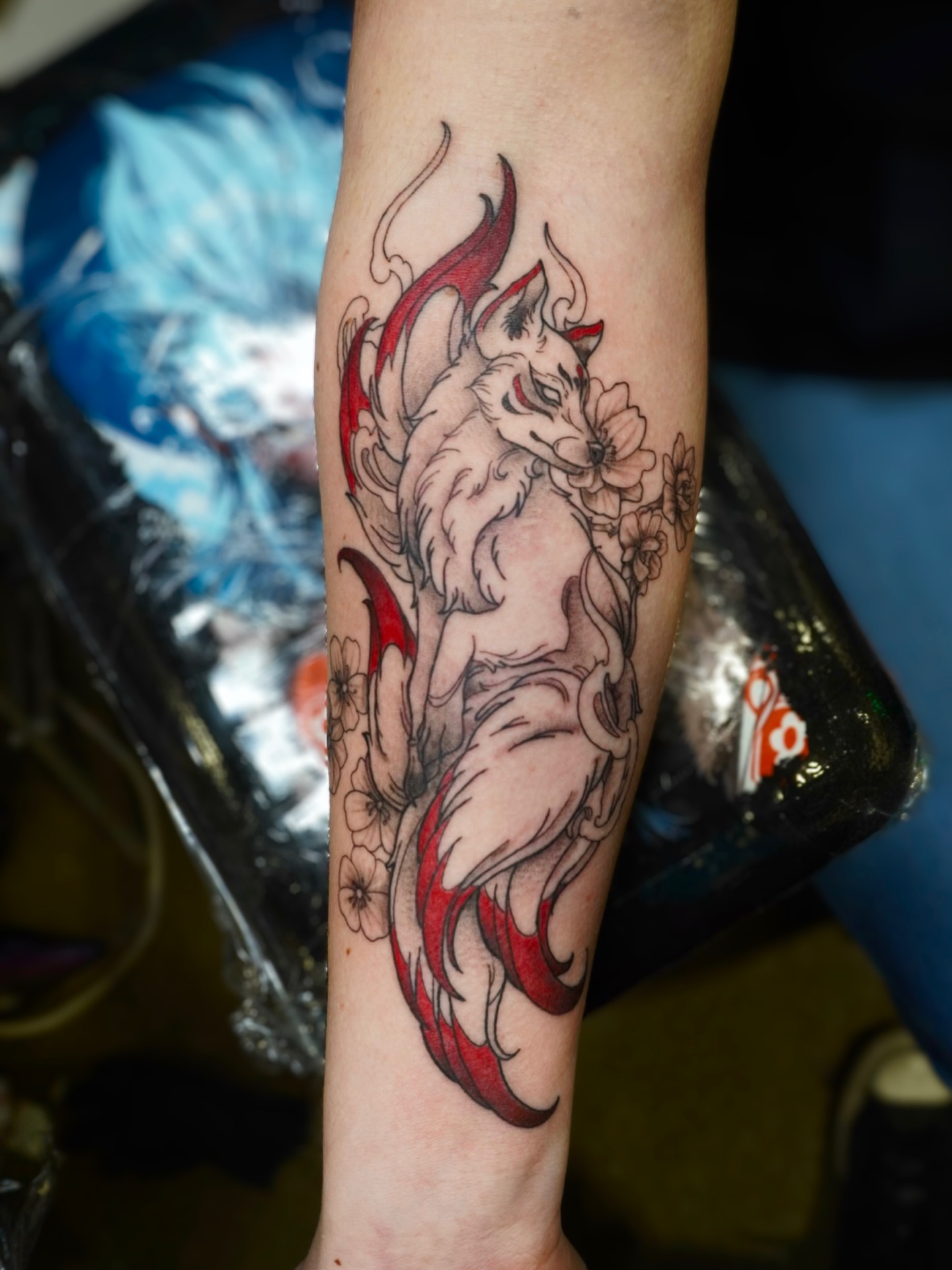 Fox with flowers japanese irezumi tattoo on the forearm by Ericka Hampton, Ferndale, Michigan