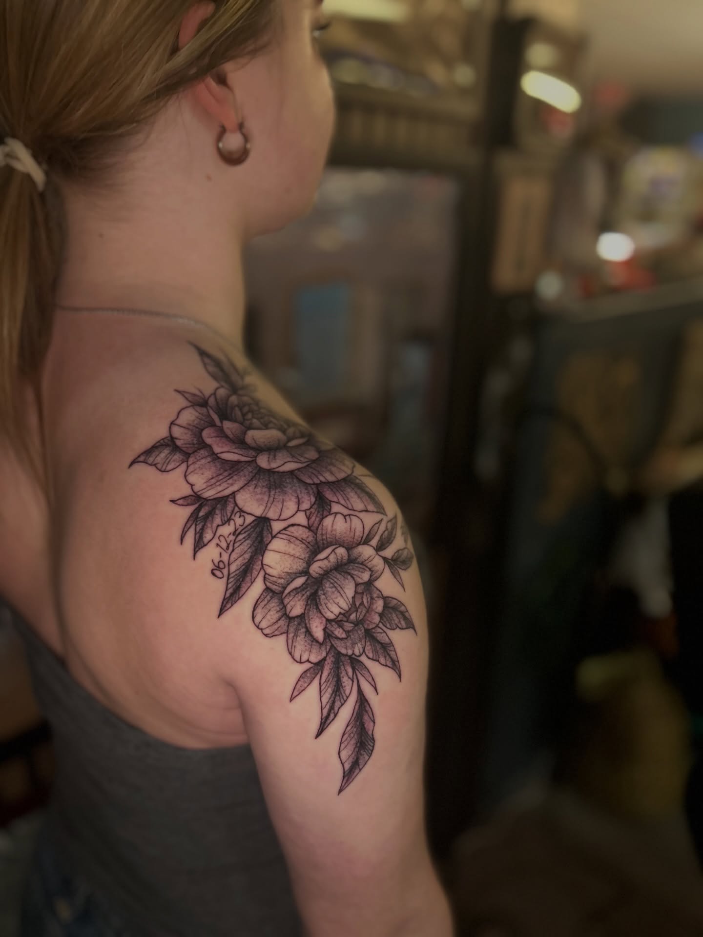 Floral bouquet black and grey tattoo on the shoulder by Torrey, Austin, Texas