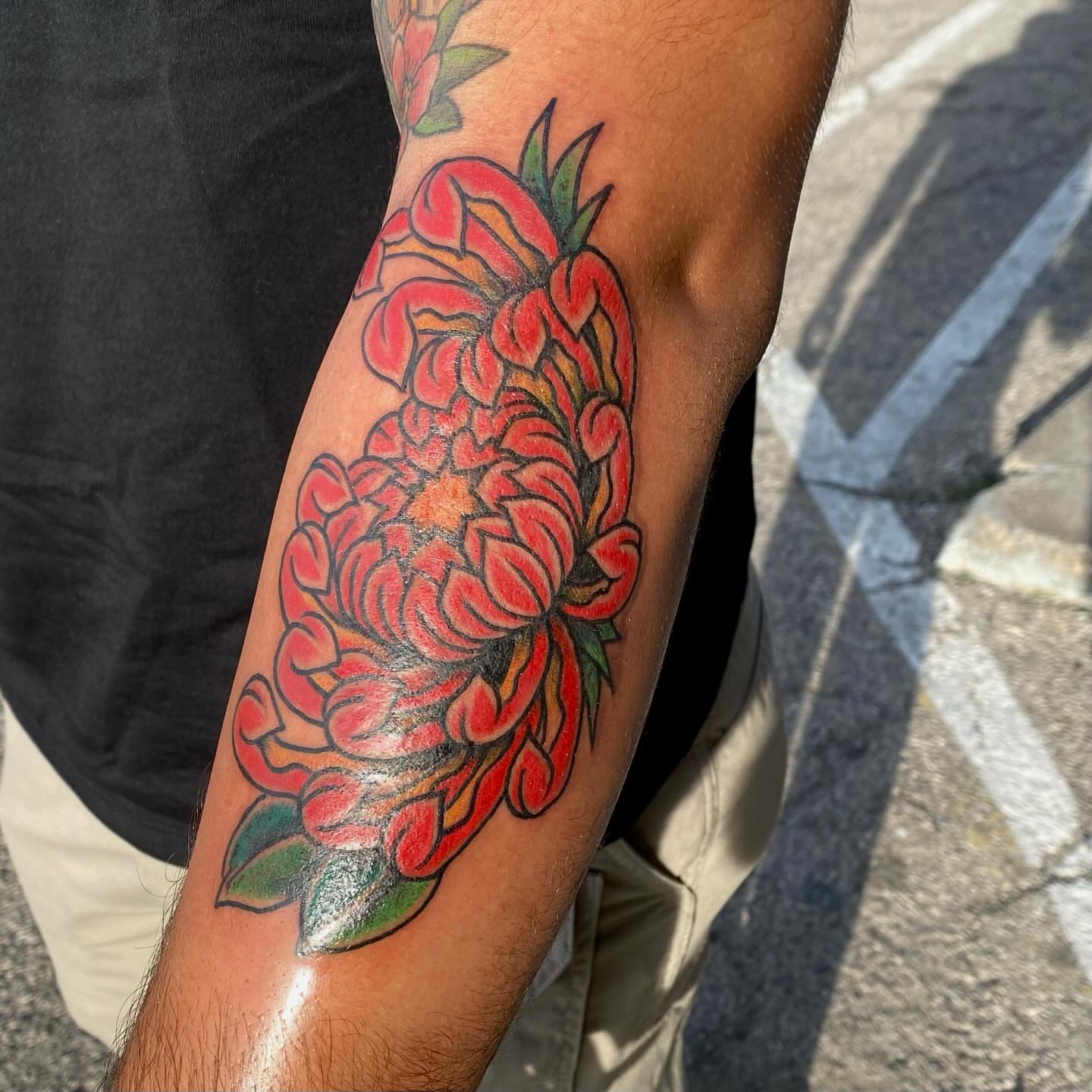 Chrysanthemum American traditional tattoo on the forearm by Las Vegas Tattoo Artist