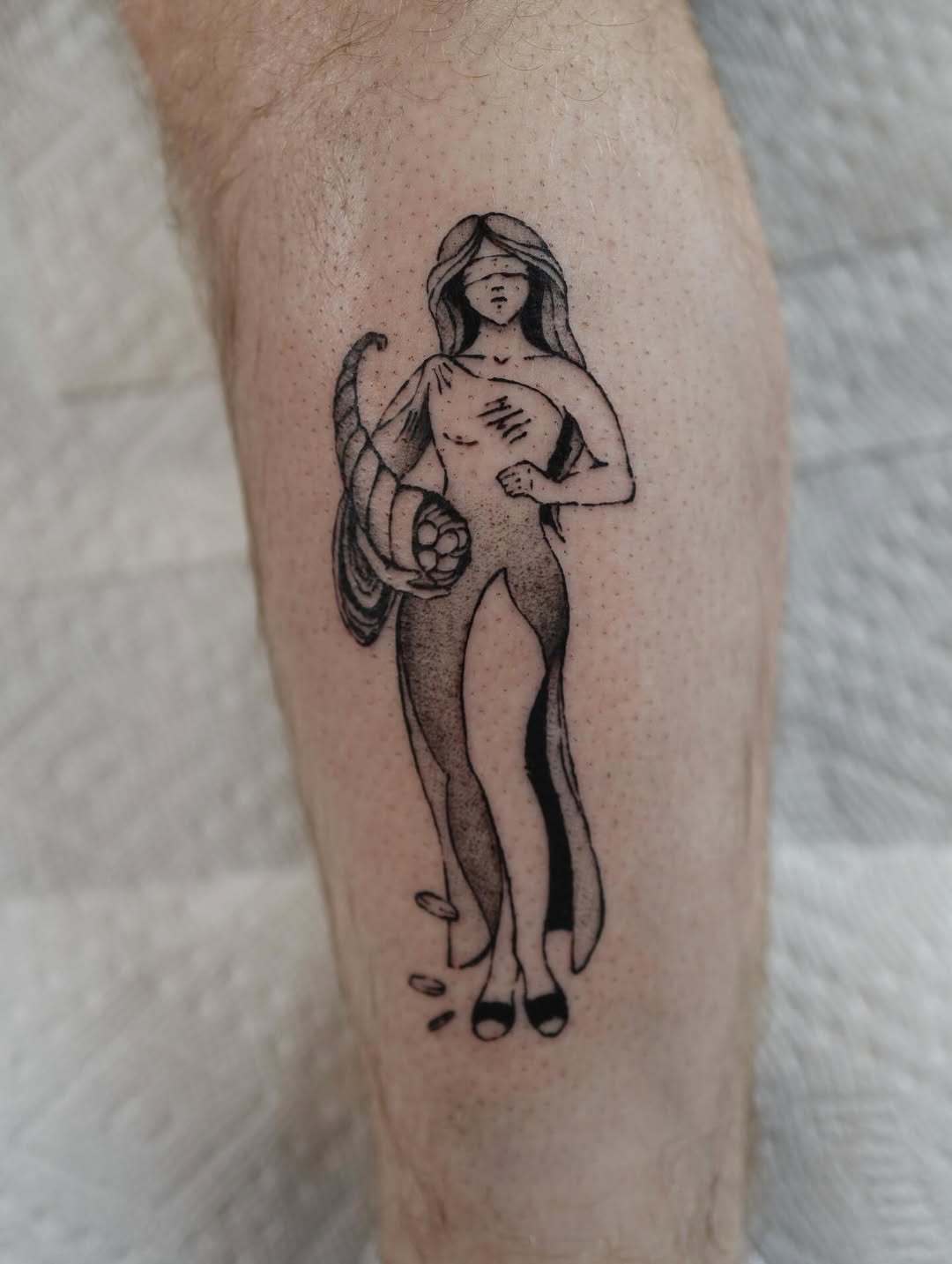 Blindfolded woman with cornucopia surrealism tattoo on the forearm by morgan purcey