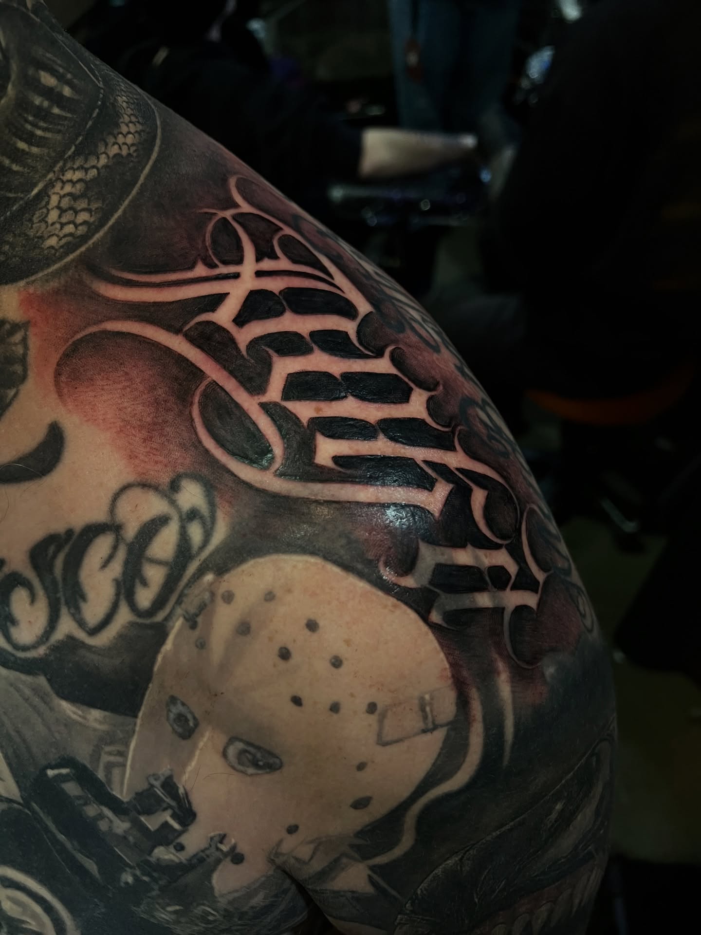 Jason mask trash polka tattoo on the shoulder by Lettering