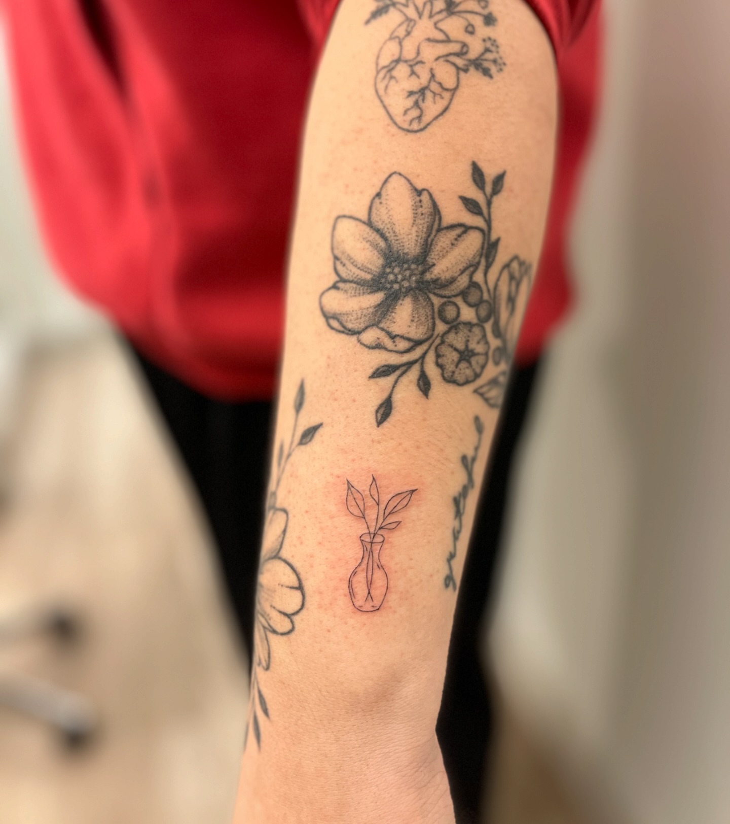 Flower arrangement black and grey tattoo on the forearm by brinley - fine line tattoos, Crescent Springs, Kentucky
