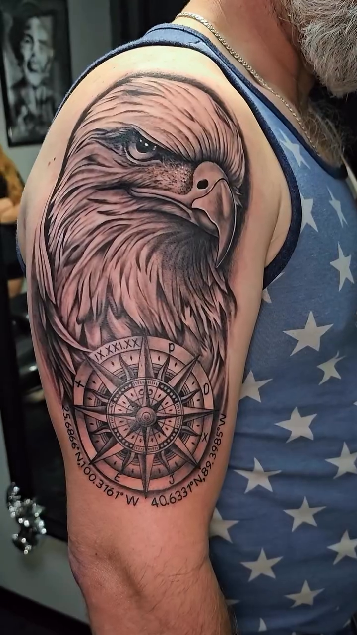 Eagle with compass realism tattoo on the upper arm by Mac Obaob