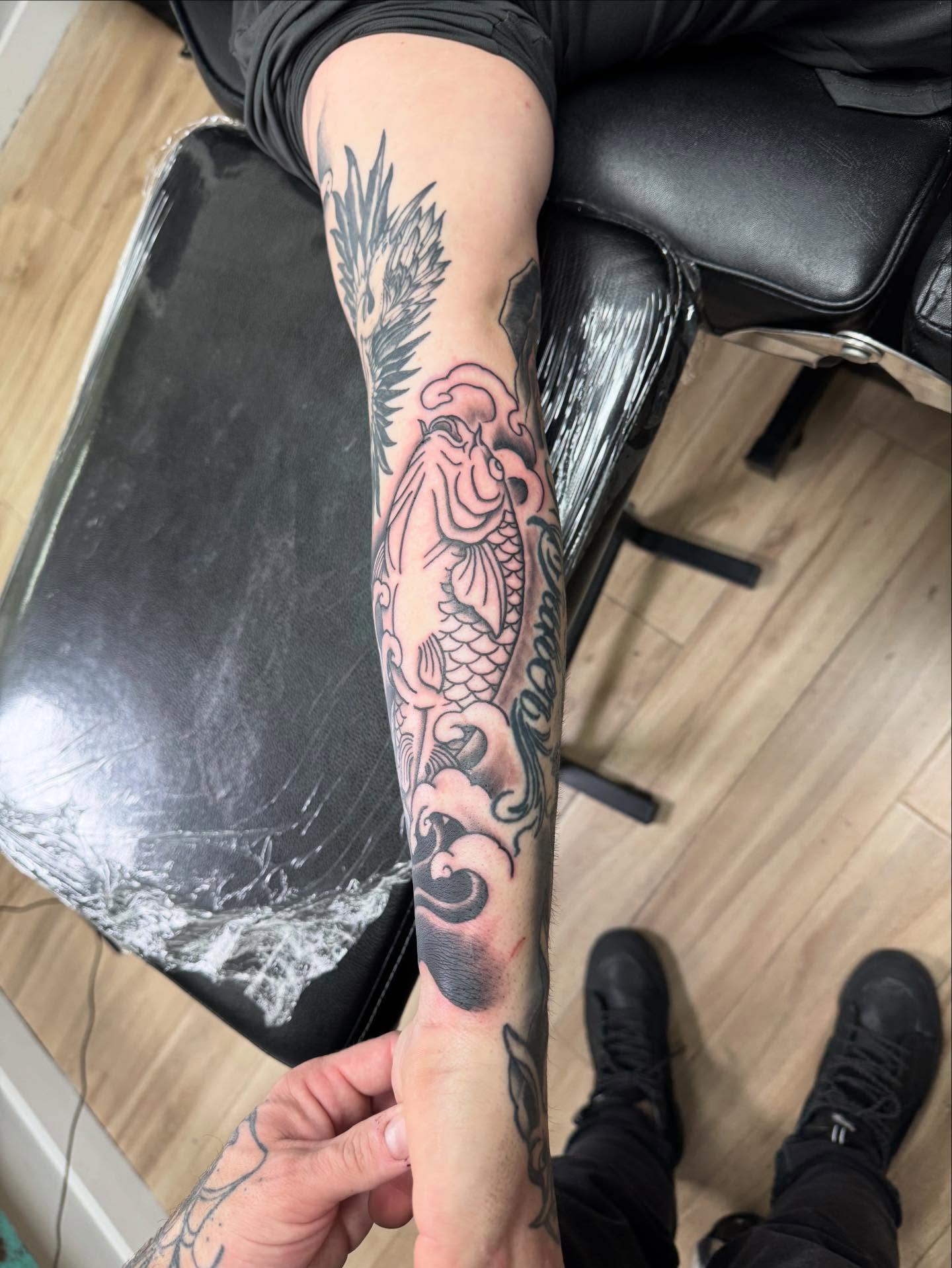 Koi fish japanese irezumi tattoo on the forearm by Jon Fleming