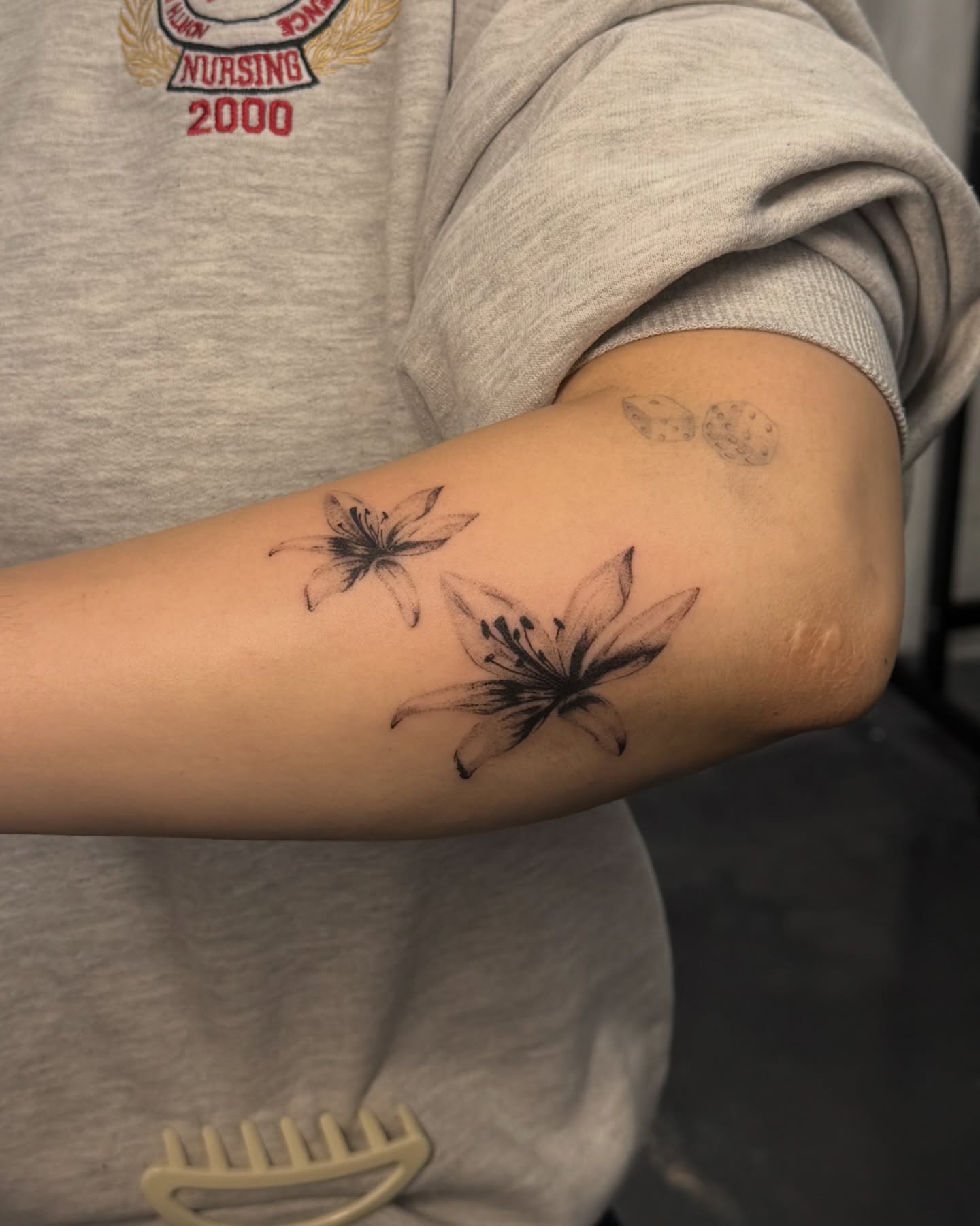 Lily flowers black and grey tattoo on the forearm by alyssa ⋆₊ ♱
