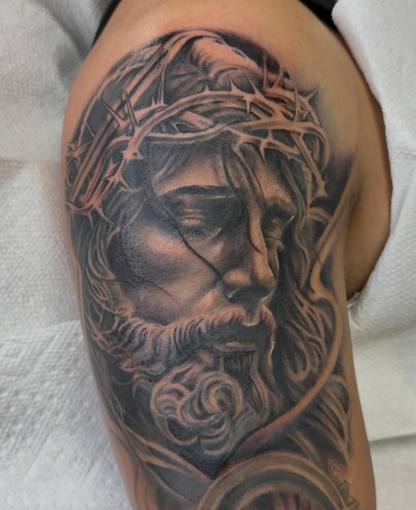 Jesus Christ realism tattoo on the shoulder by Las Vegas Tattoo Artist