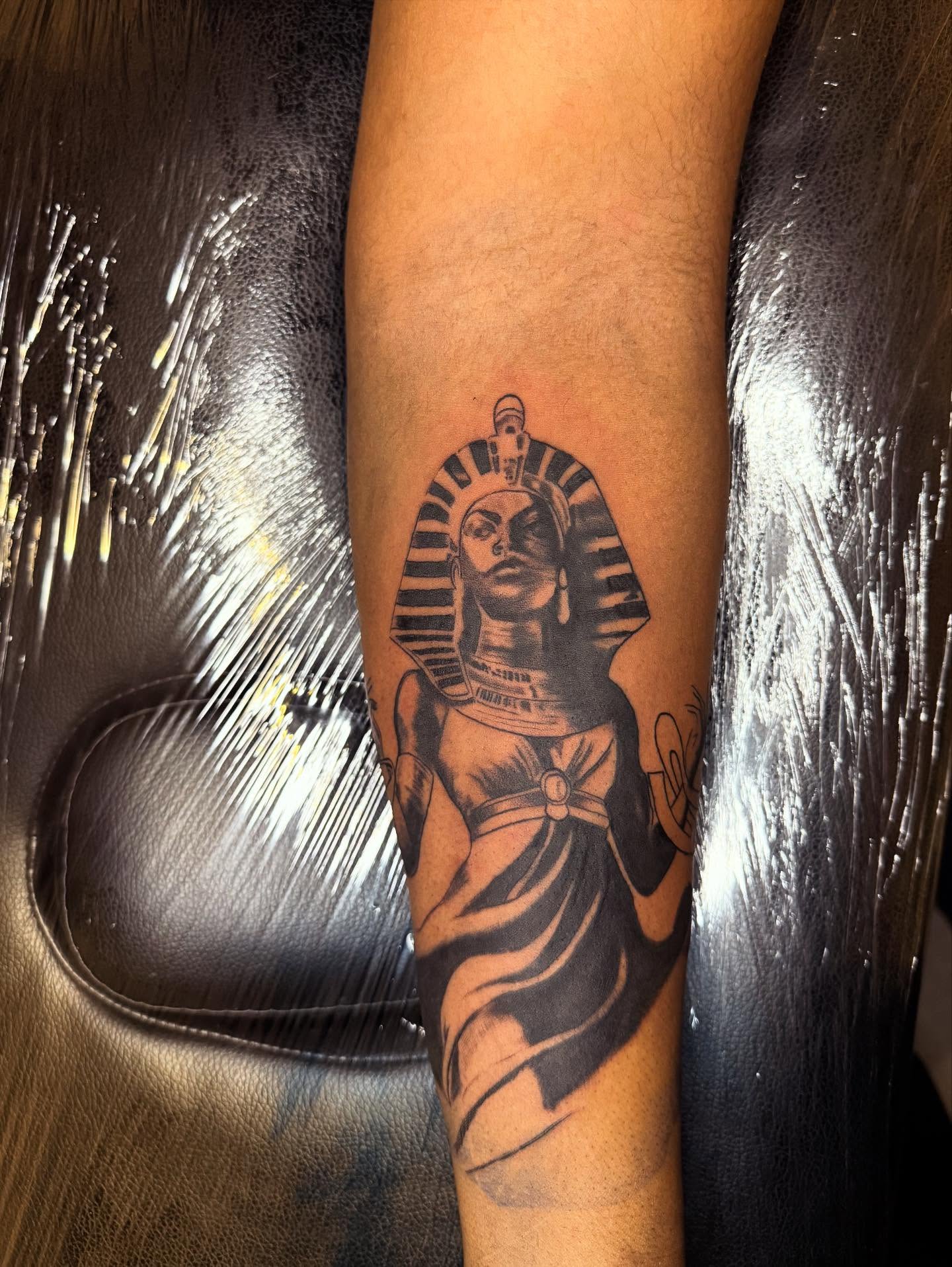 Pharaoh black and grey tattoo on the forearm by Noir