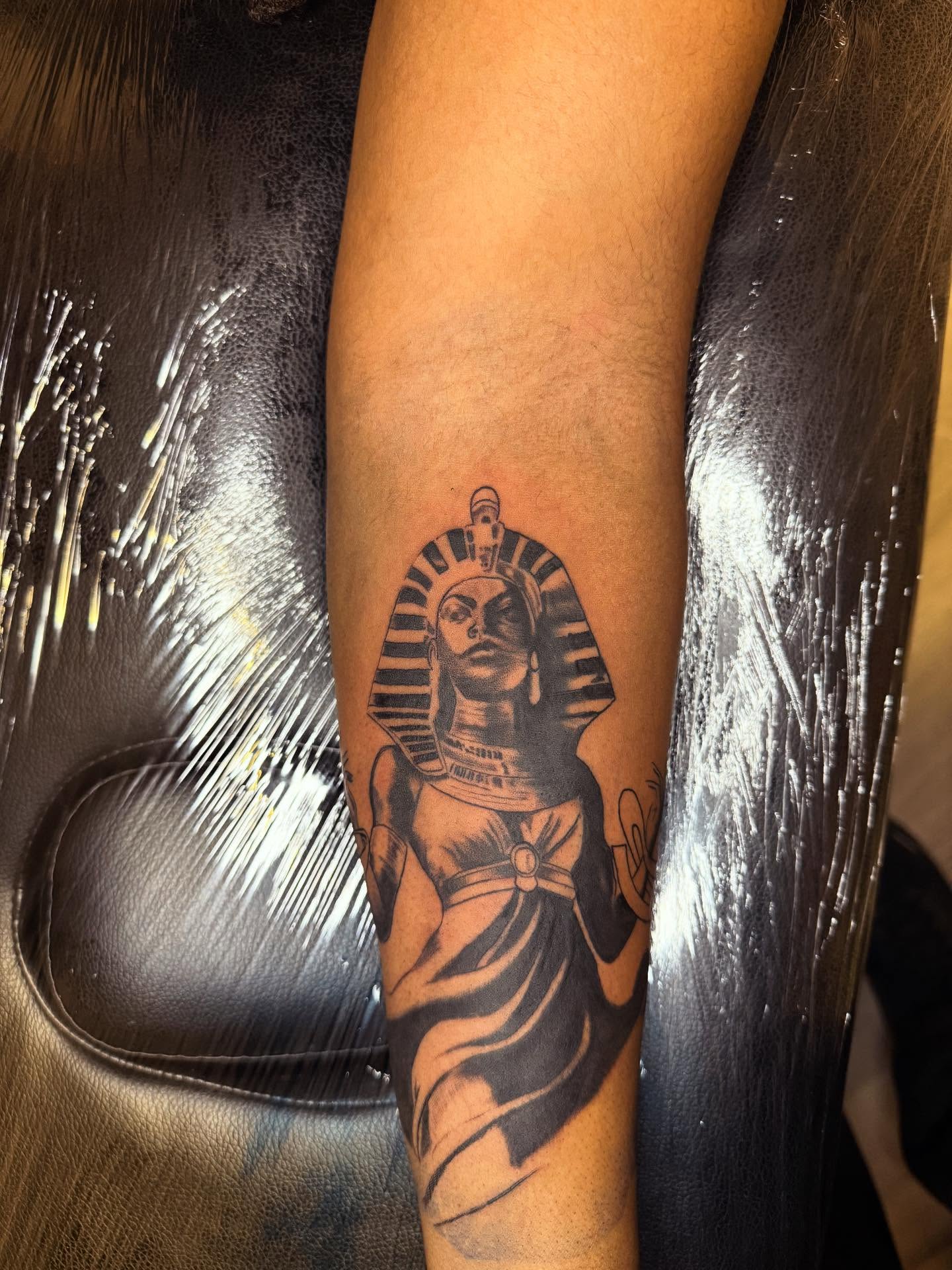Pharaoh black and grey tattoo on the forearm by Noir