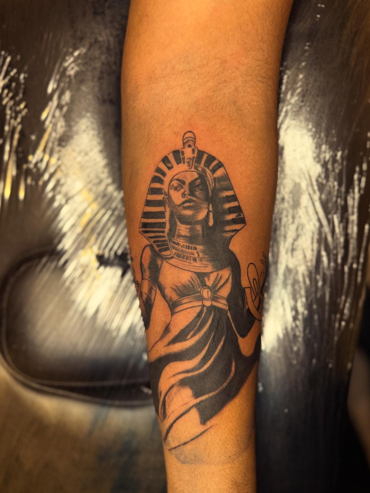 Pharaoh black and grey tattoo on the forearm by Noir