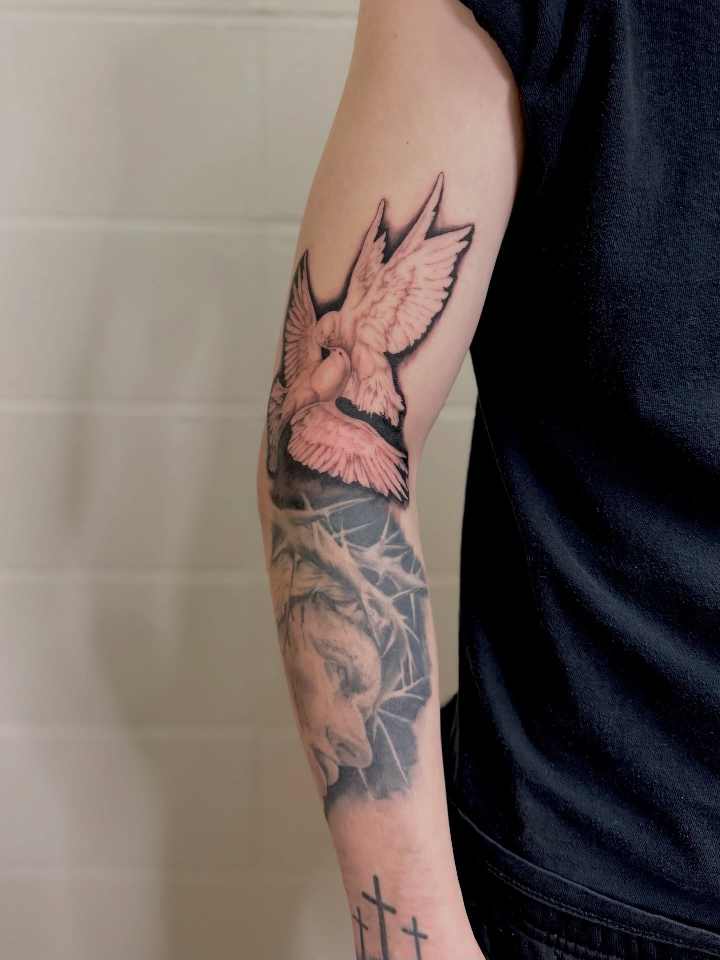 Dove and crown realism tattoo on the forearm by πππ¦