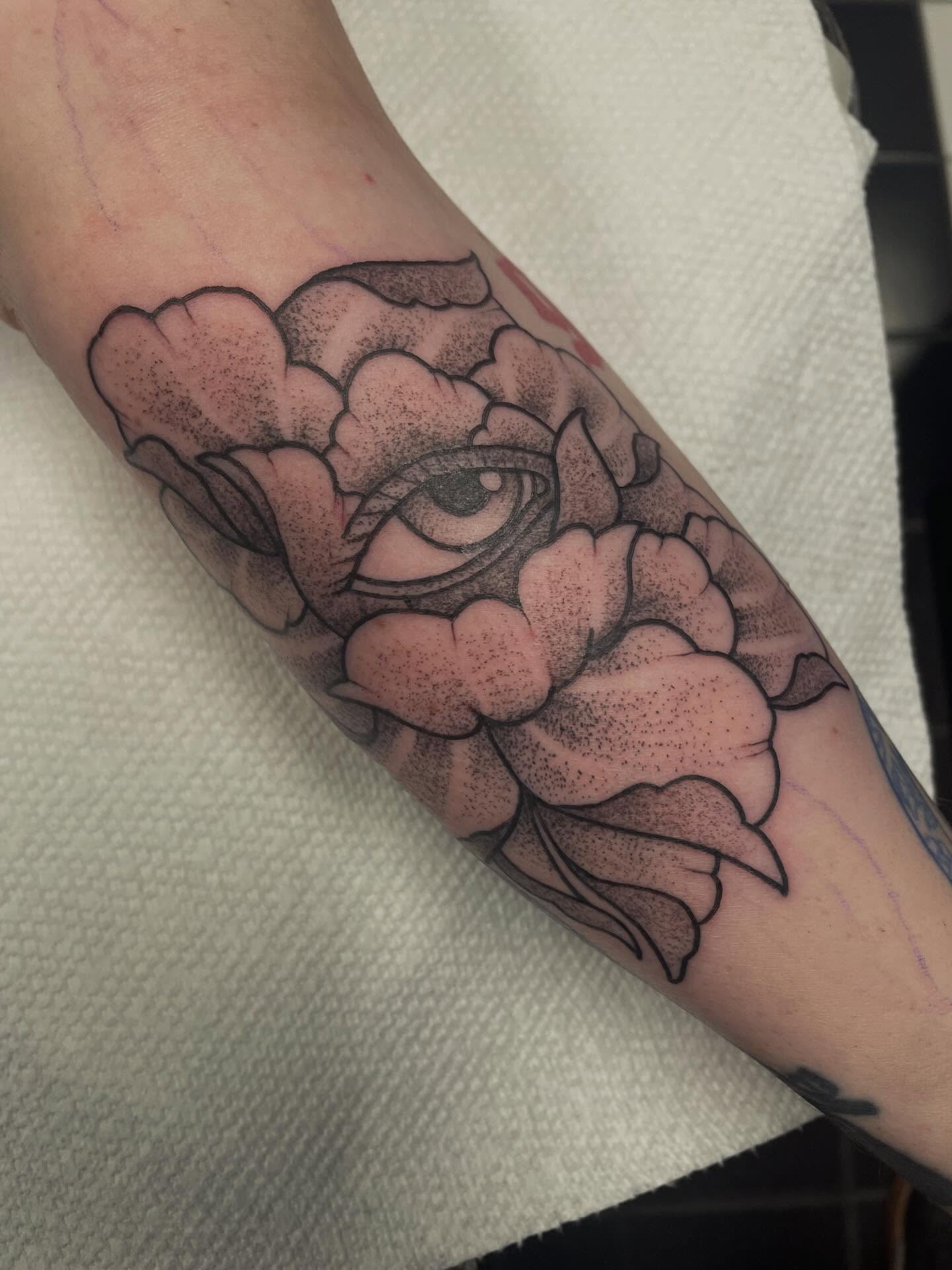 Flower with eye dotwork tattoo on the forearm by Andres Patino 🇪🇨🇺🇸