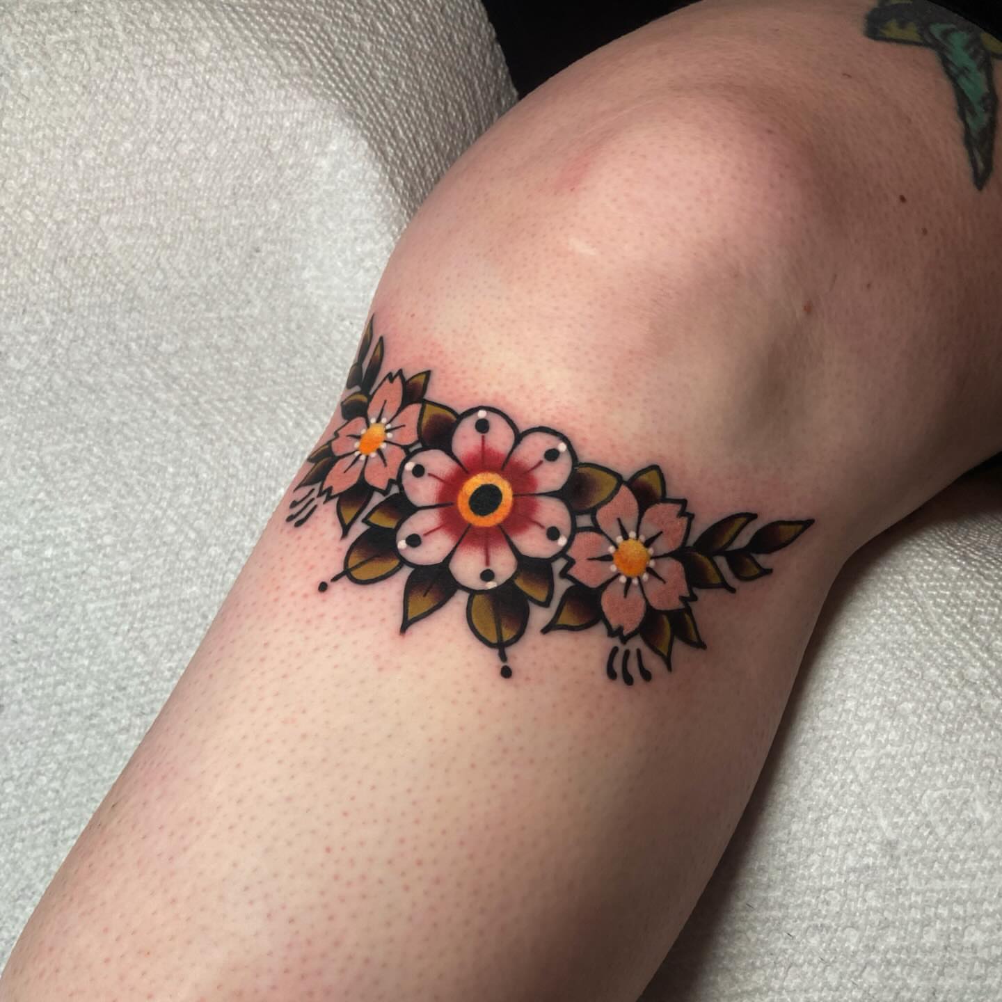 Floral arrangement American traditional tattoo on the forearm by Matthew Limbers⚜️