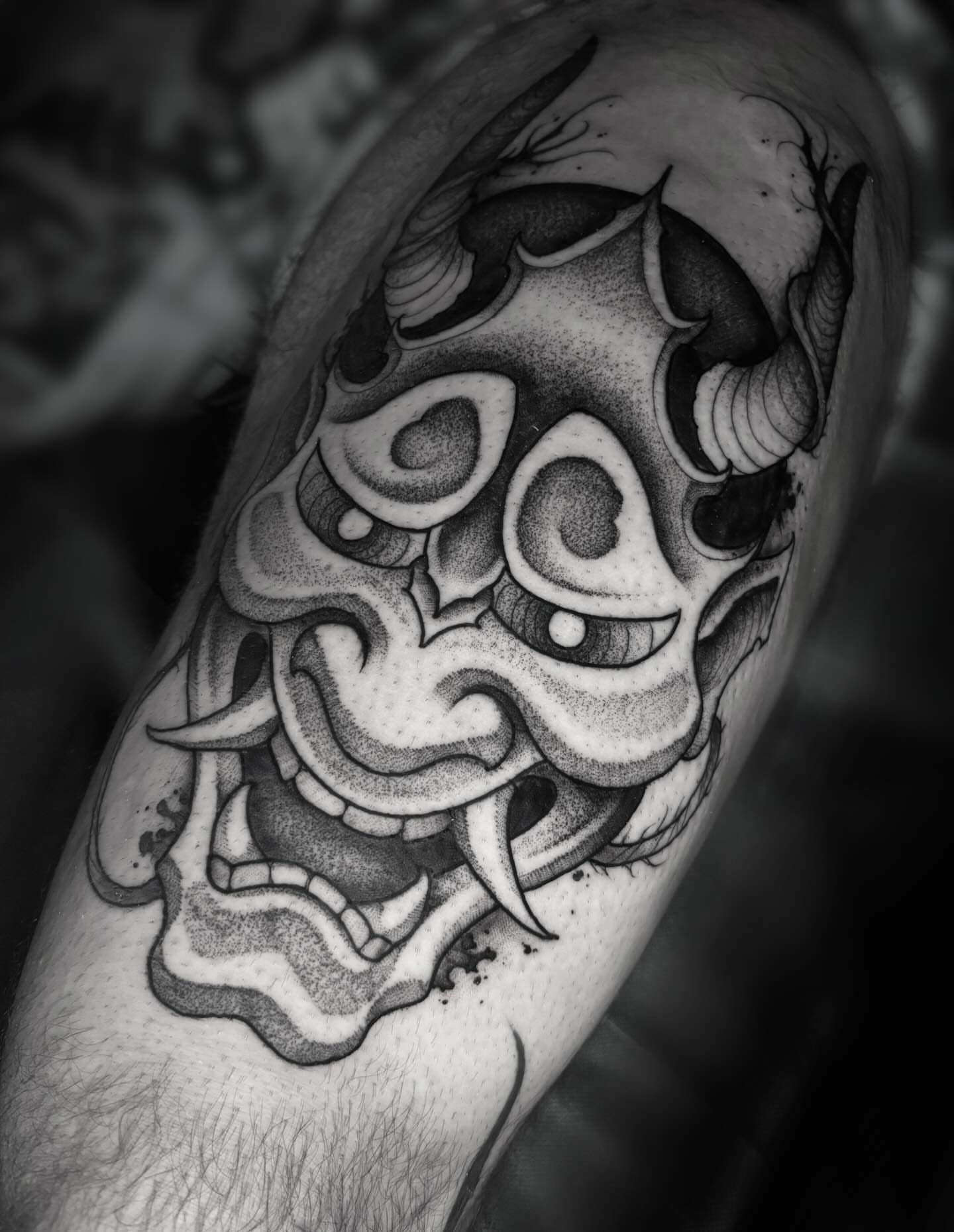 Mask dotwork tattoo on the forearm by Sofia Rose