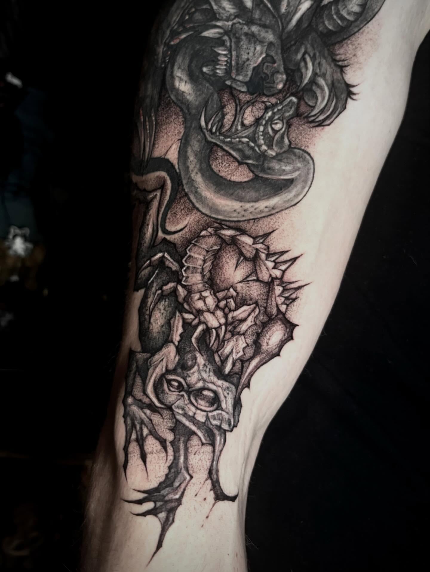 Snake and skull realism tattoo on the forearm by ๐ท๐๐๐๐