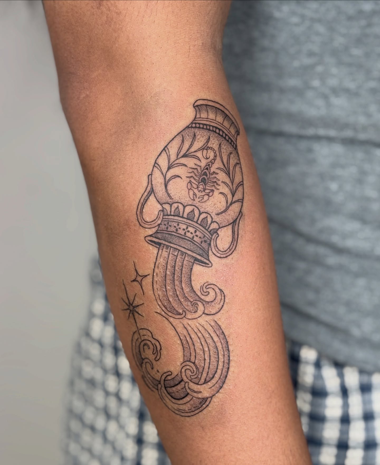 Torch and flame black and grey tattoo on the forearm by Fineline tattoos by Kinsey