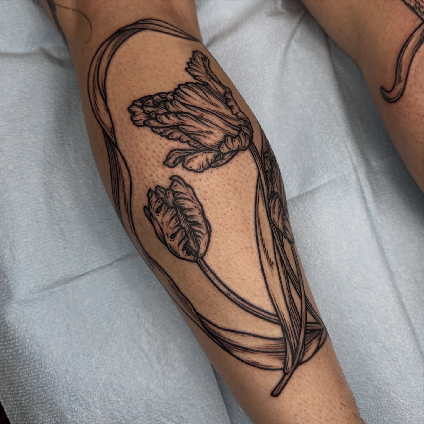 Flower black and grey tattoo on the forearm by rosalie