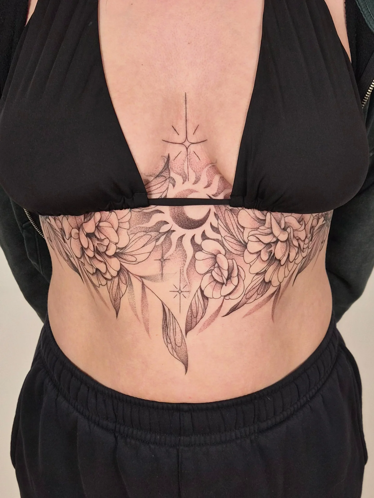 Floral and celestial geometric tattoo on the torso by Sophorn Long (soapy)
