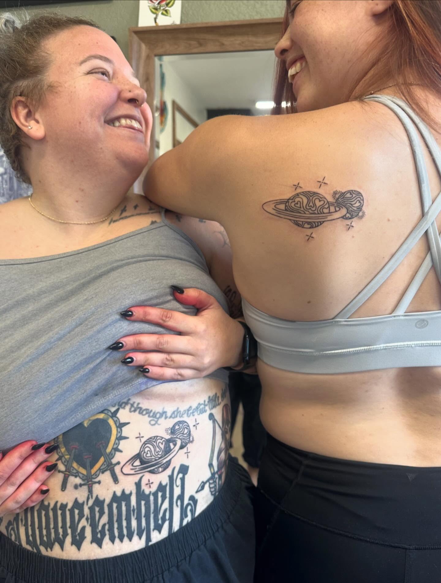 Space theme black and grey tattoo on the back by Kaylee Woods