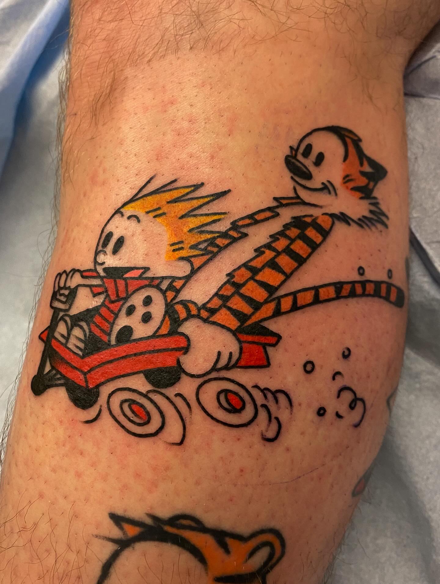 Calvin and hobbes American traditional tattoo on the forearm by Abby Rose Estes