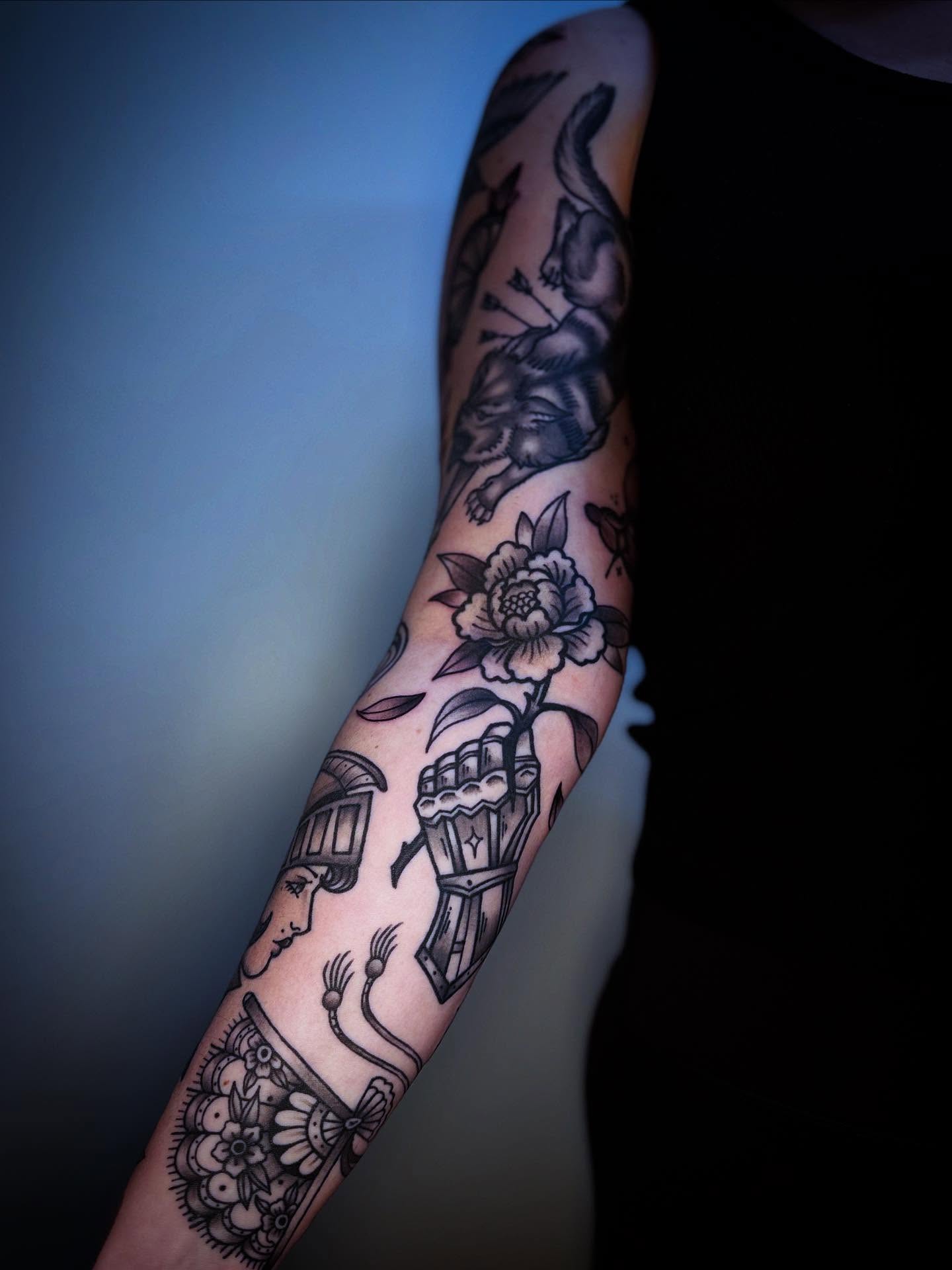 Floral and animal American traditional tattoo on the forearm by Eden H., Columbus, Ohio