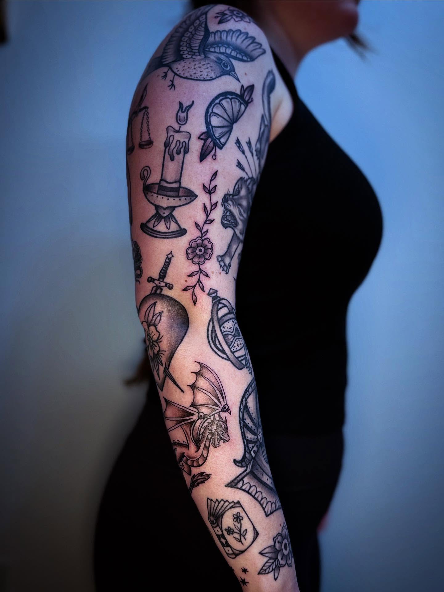 Mythical creature and floral motifs American traditional tattoo on the forearm by Eden H., Columbus, Ohio