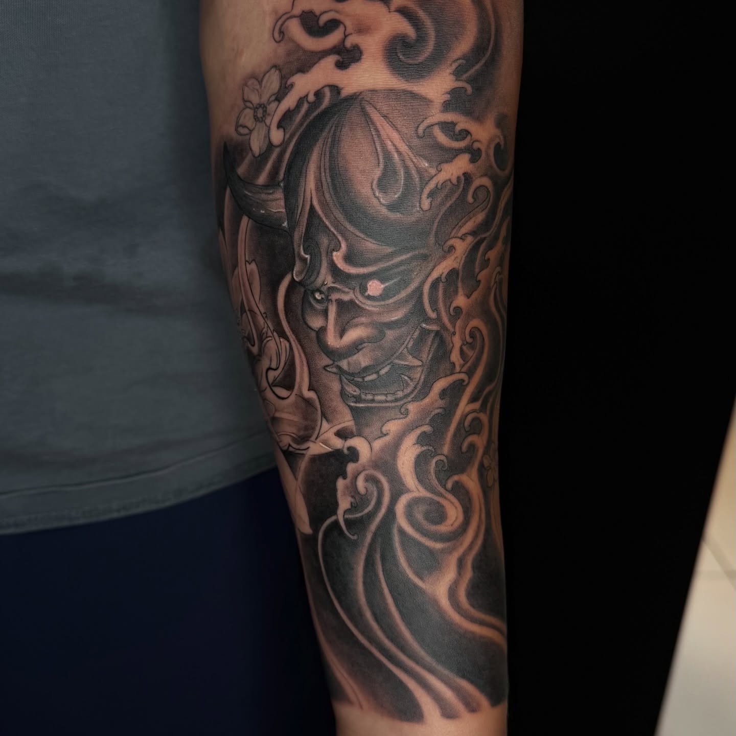 Japanese mask realism tattoo on the forearm by B o n d B o n d , “ a r t i s t “