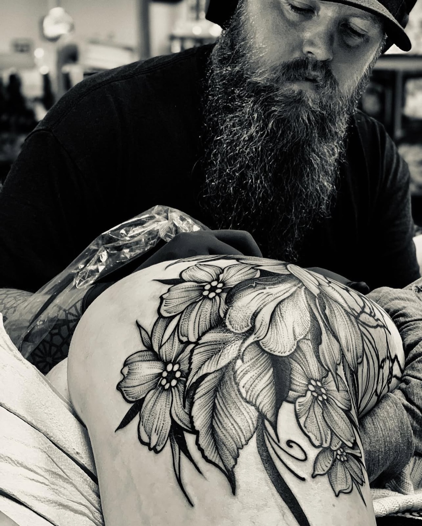 Floral bouquet black and grey tattoo on the shoulder by Sterling Grice