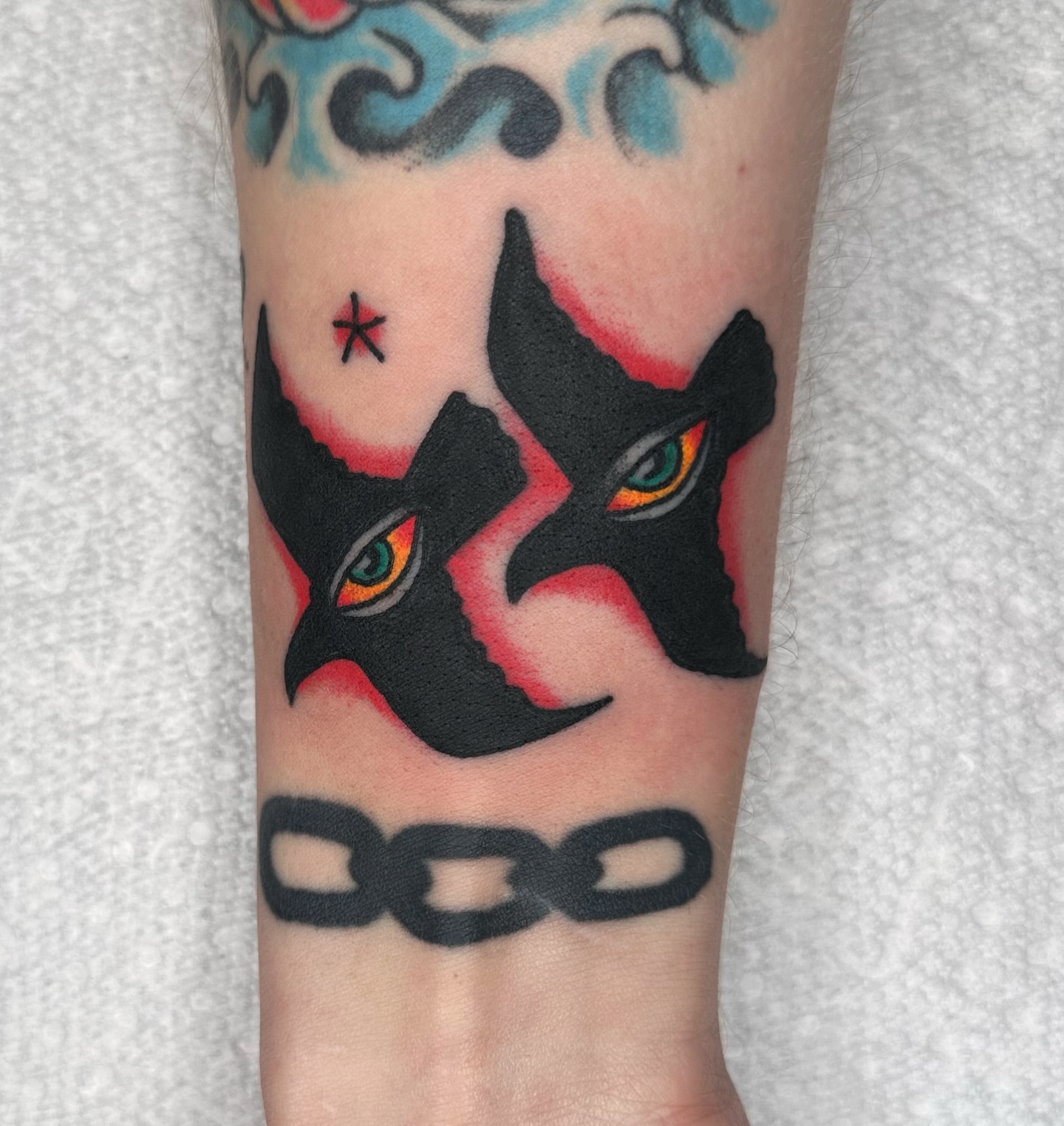 Demon faces American traditional tattoo on the forearm by Brock Johnson