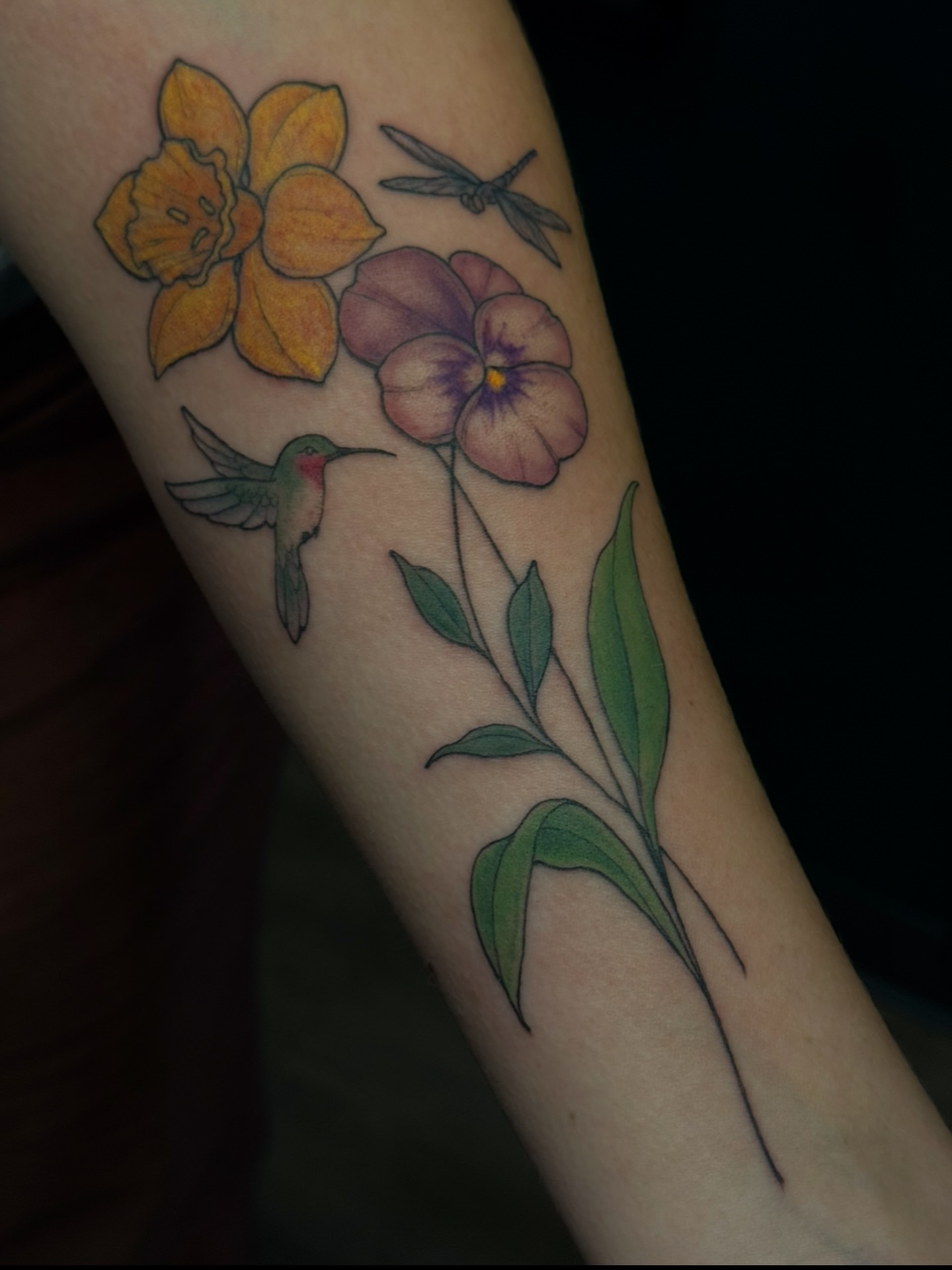Flowers and hummingbird realism tattoo on the forearm by jess jené jones, Portland, Oregon