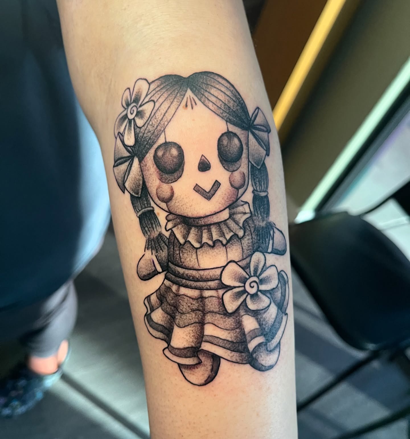 Rag doll dotwork tattoo on the forearm by Alex