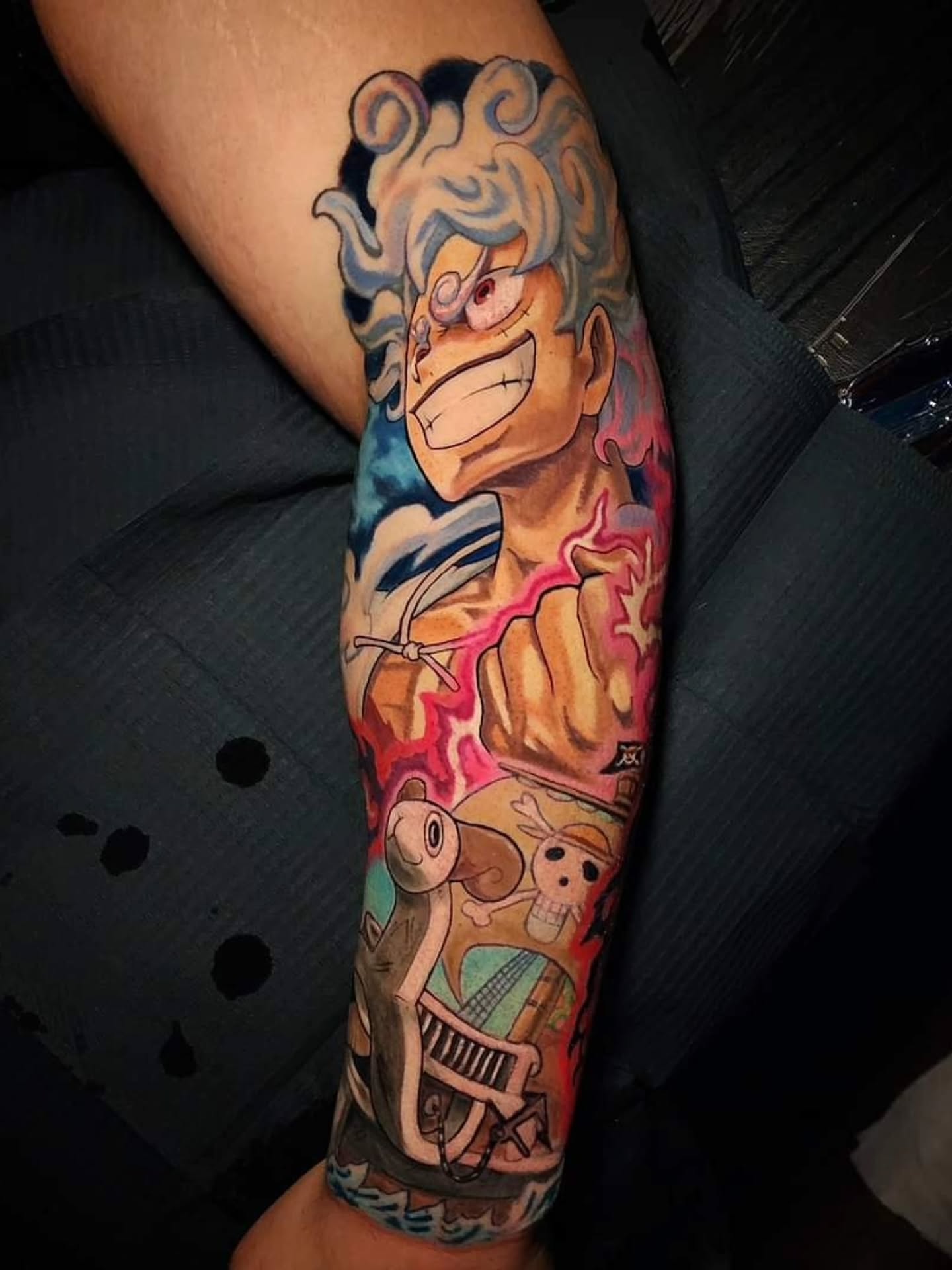 One Piece characters anime tattoo on the forearm by Chicago Tattoo Artist New School Tattoos, Naperville, Illinois