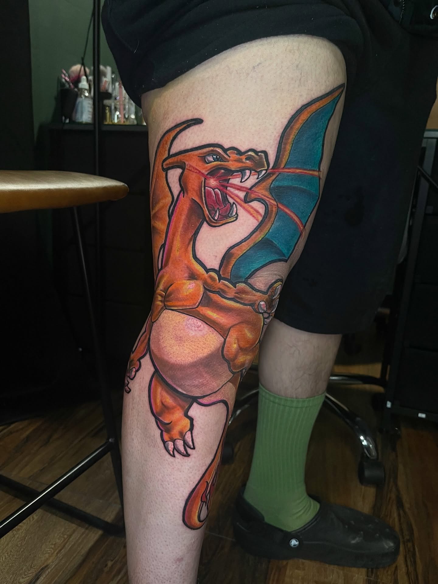 Charizard new school tattoo on the thigh by Monstro Ink Arts Tattoos, Bakersfield, California