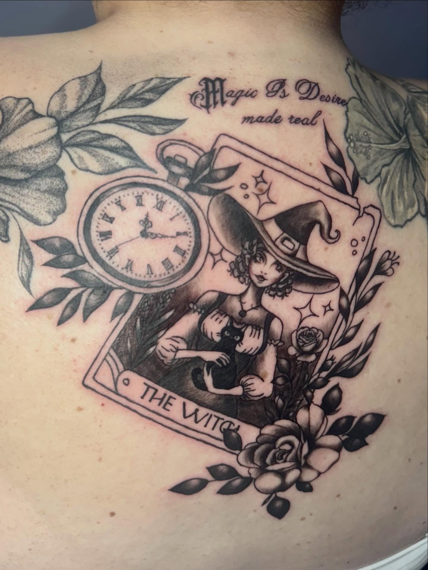The witch black and grey tattoo on the back by Gigi