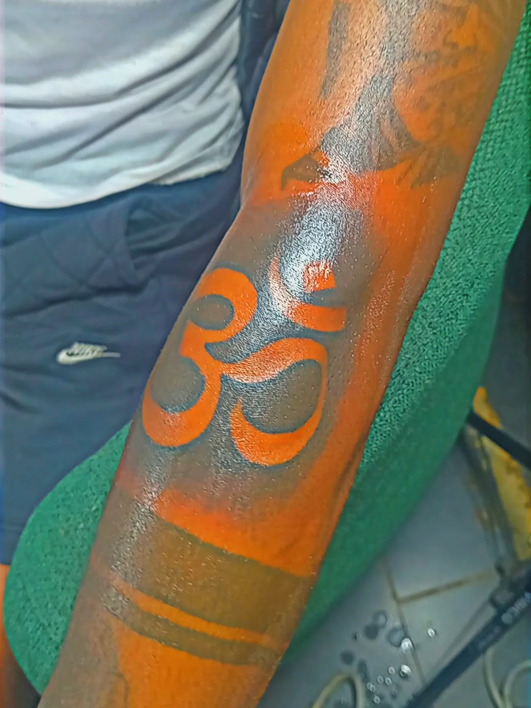 Om symbol geometric tattoo on the forearm by Mwangaza Bodyworks, Uthiru, Nairobi Area, Kenya