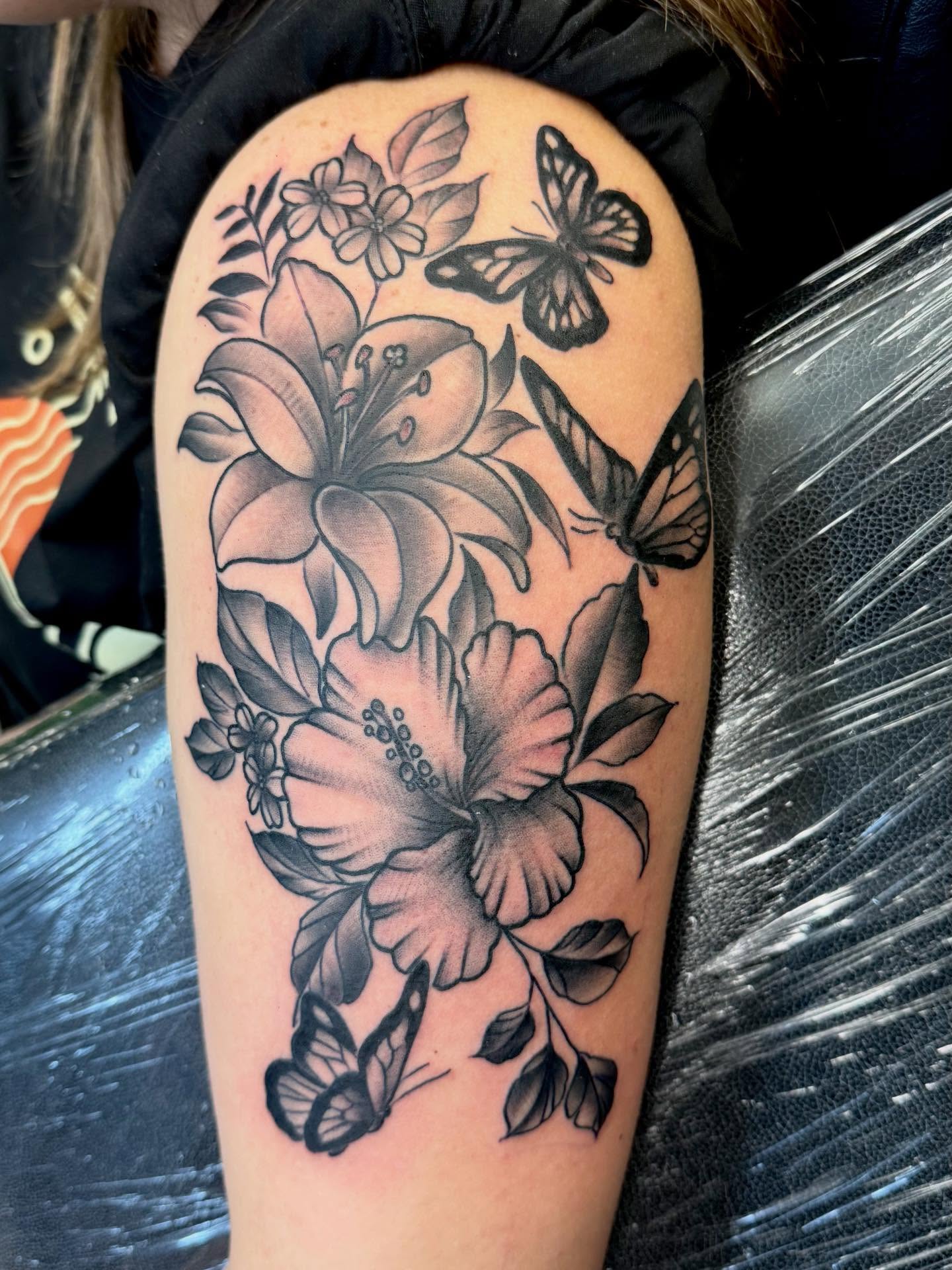 Flowers and butterflies black and grey tattoo on the forearm by Josh Roberts, Franklin, Ohio