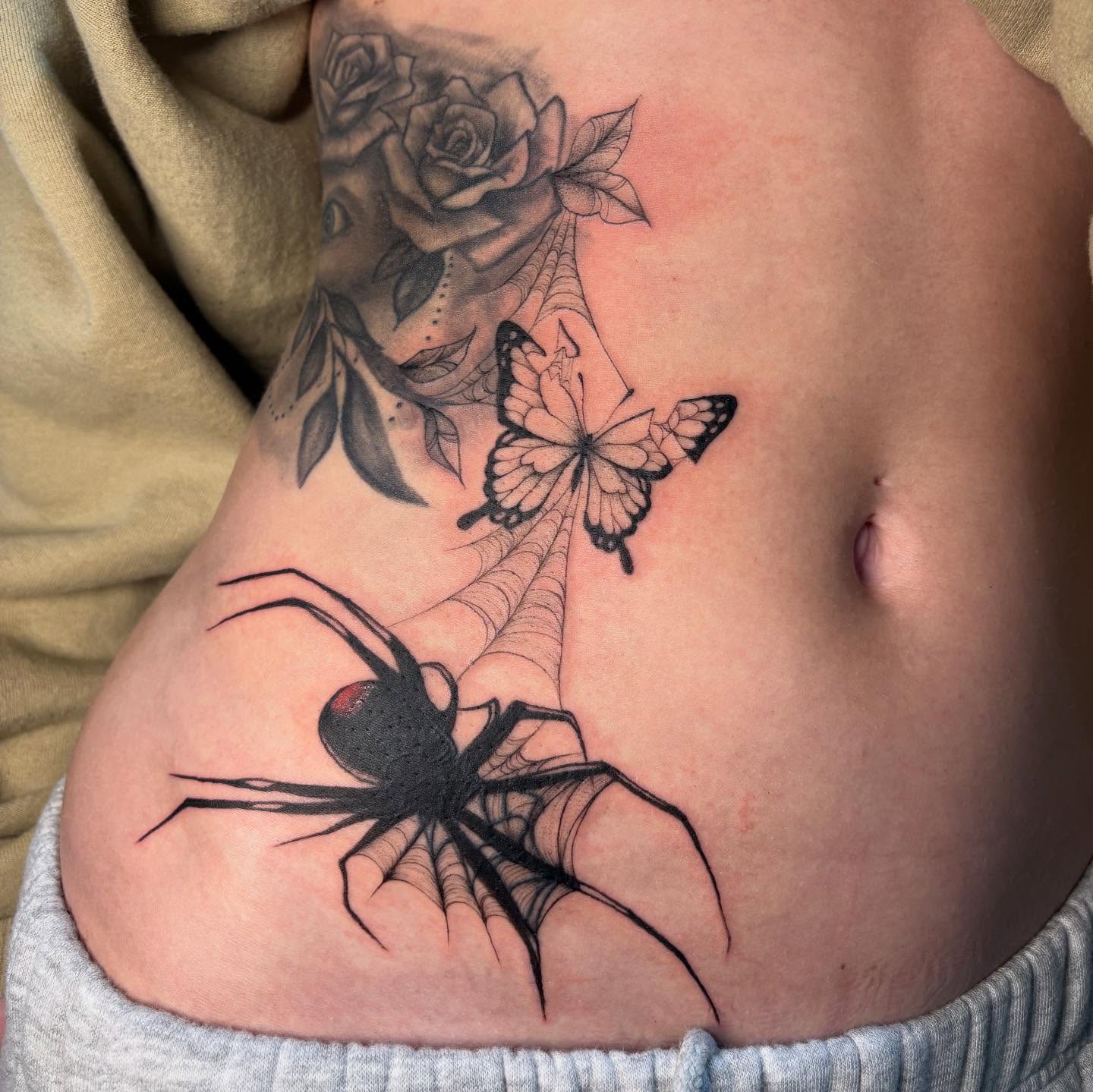 Spider web and butterfly realism tattoo on the ribs by ꩜ 𖦹