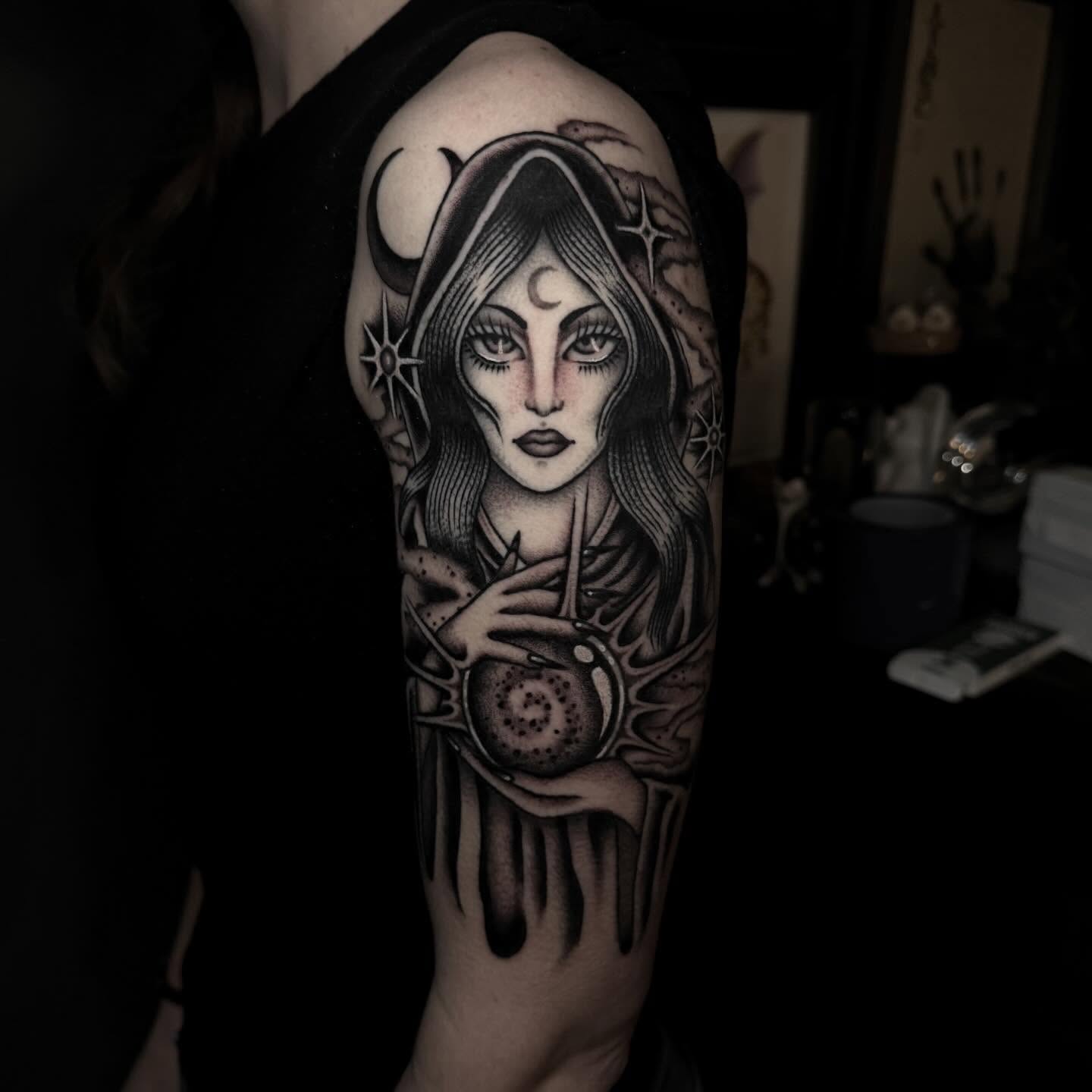 Woman with crescent moon and stars realism tattoo on the forearm by Julia Louise