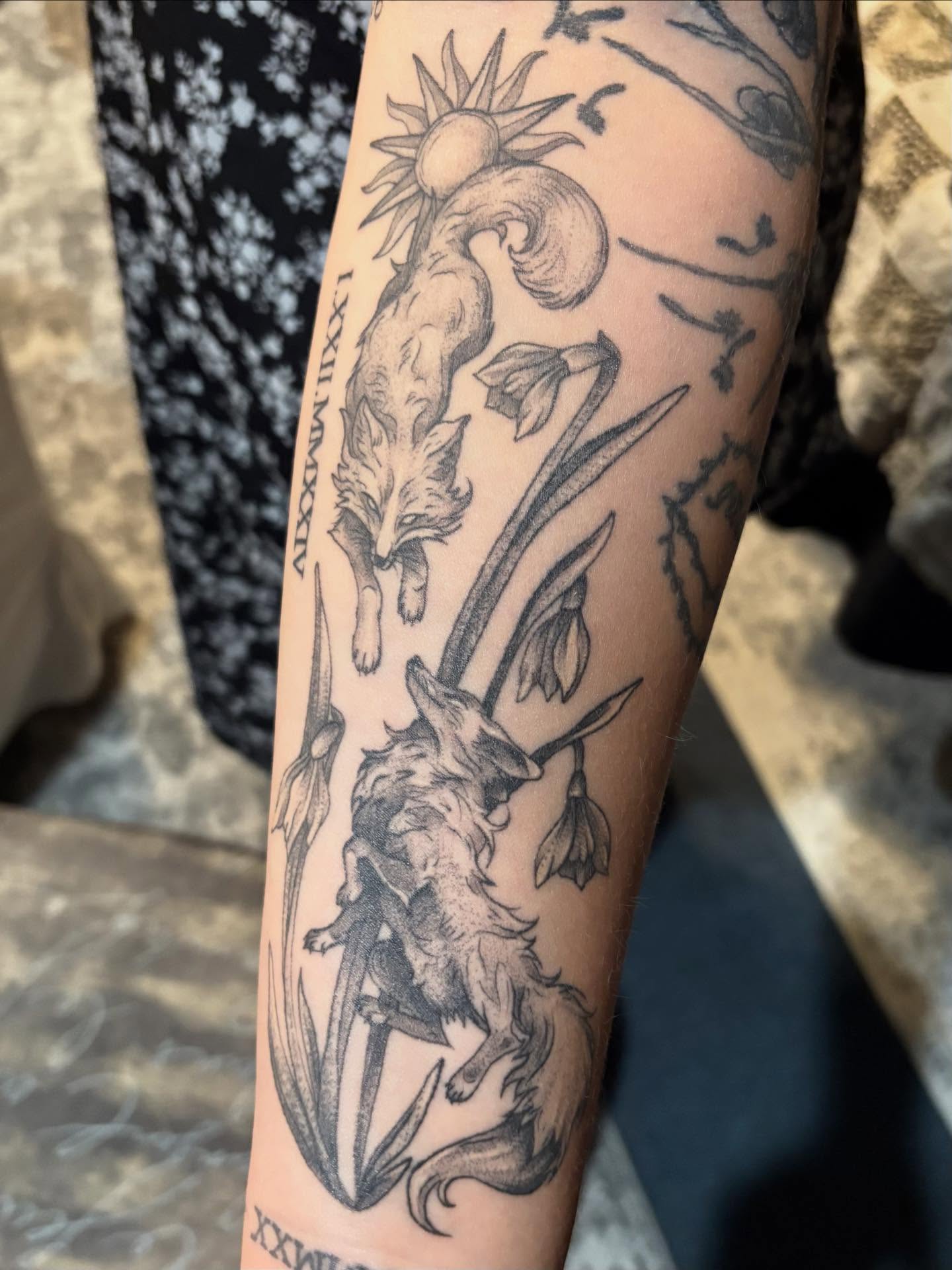 Goat and flowers black and grey tattoo on the forearm by Olivia Buch