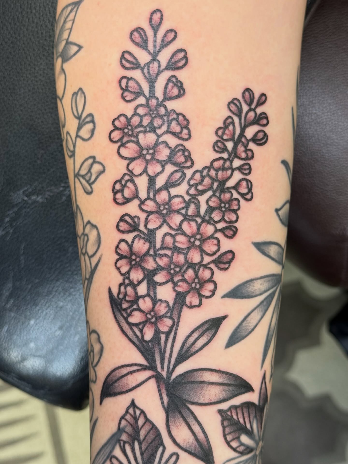 Flower bouquet black and grey tattoo on the forearm by Kelsey Louis, Iowa City, Iowa
