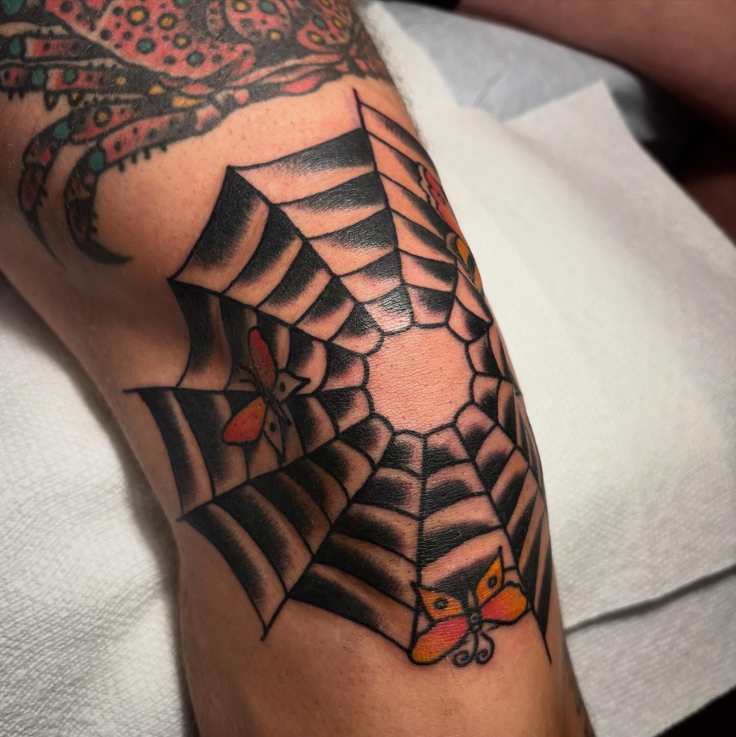 Spider web geometric tattoo on the forearm by Danny DiBlasi, San Francisco, California