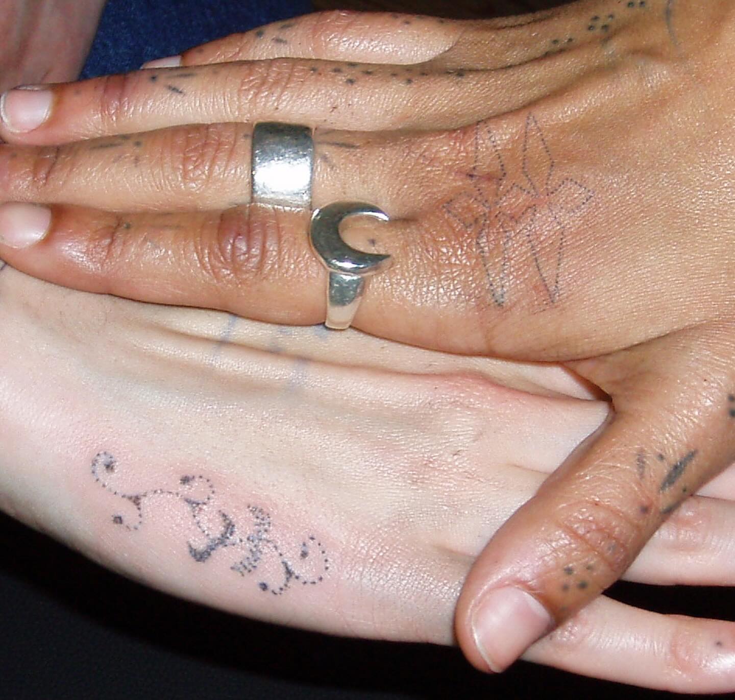 Moon and stars dotwork tattoo on the hand by kari