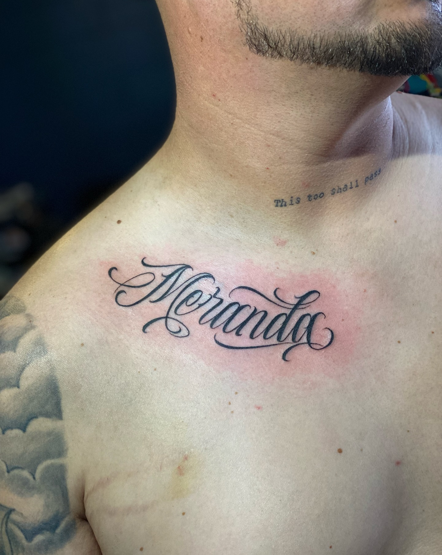 Meranda lettering script tattoo on the chest by Lex Miranda