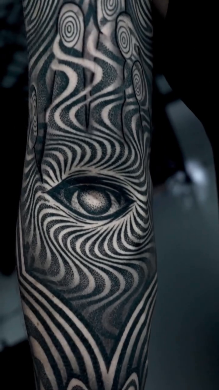 Abstract optical illusion sleeve surrealism tattoo on the upper arm by Ilya Cascad Kandaurov